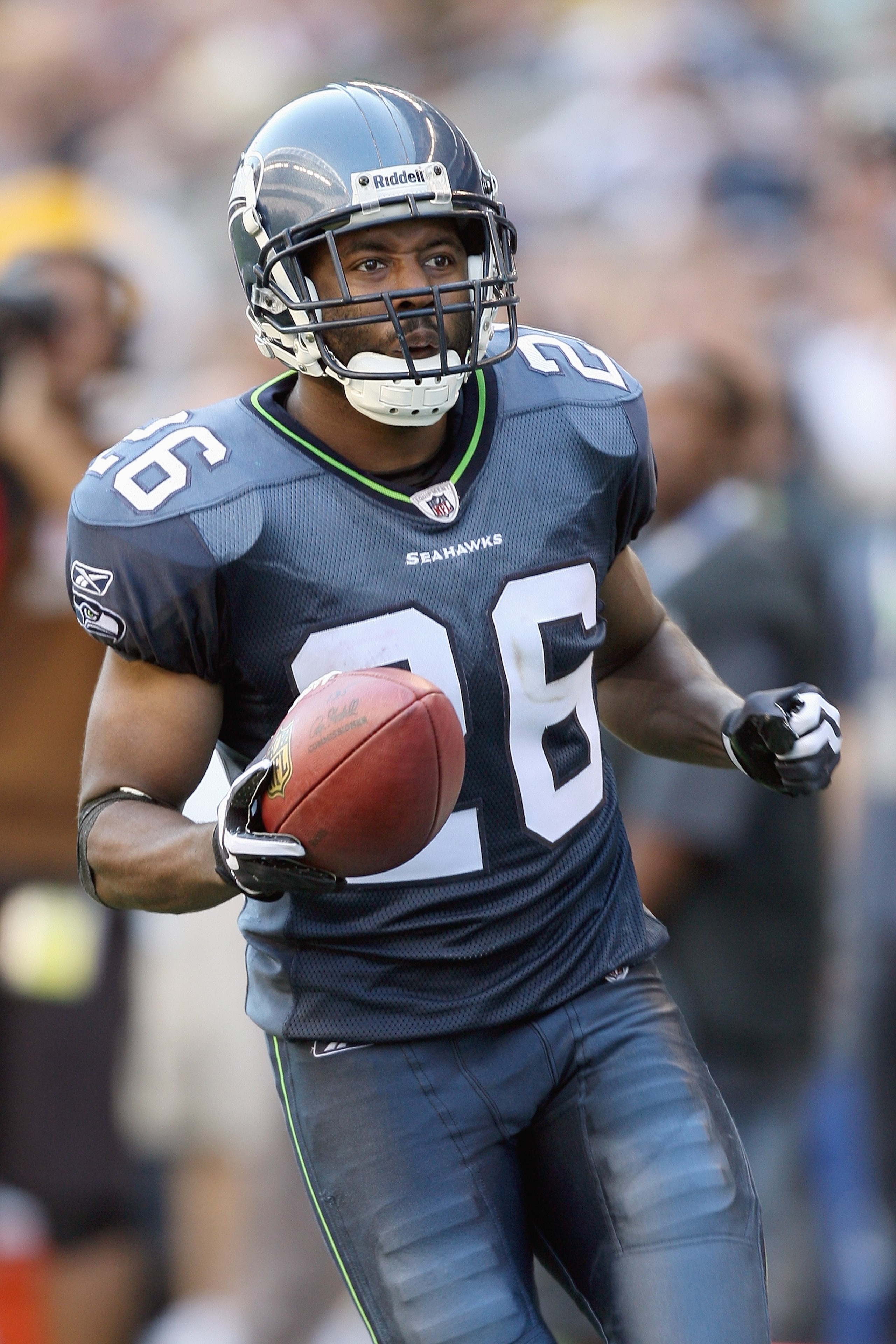 SEATTLE , WA - SEPTEMBER 13: Josh Wilson #26 of the Seattle Seahawks jogs with the ball during the game against the St. Louis Rams at Qwest Field on September 13, 2009 in Seattle, Washington. (Photo by Otto Greule Jr/Getty Images) SEATTLE , WA - SEPTEMBER 13: Josh Wilson #26 of the Seattle Seahawks jogs with the ball during the game against the St. Louis Rams at Qwest Field on September 13, 2009 in Seattle, Washington. (Photo by Otto Greule Jr/Getty Images)