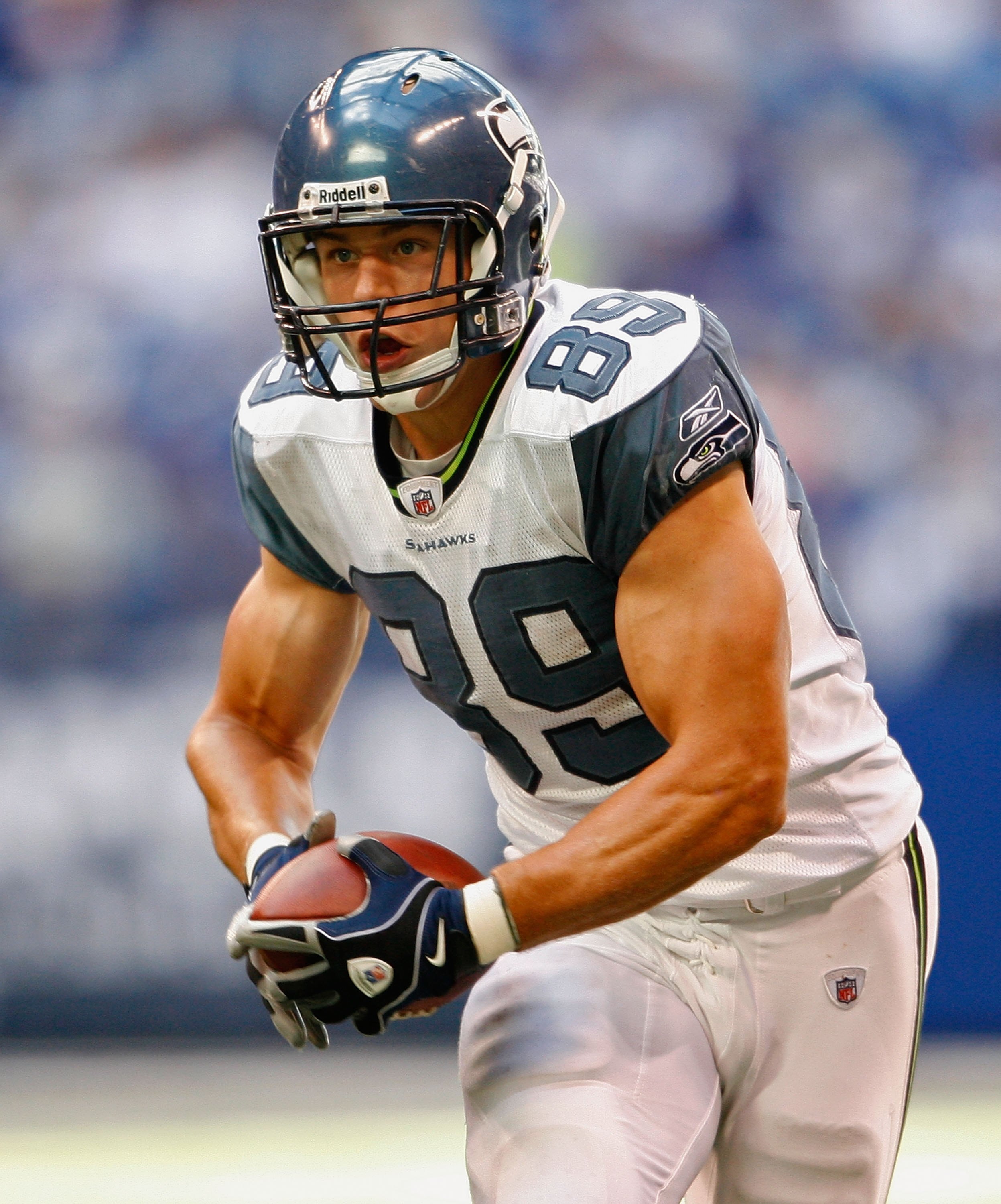 INDIANAPOLIS - OCTOBER 04:  John Carlson #89 of the the Seattle Seahawks runs with the ball during the NFL game against the Indianapolis Colts at Lucas Oil Stadium on October 4, 2009 in Indianapolis, Indiana.  (Photo by Andy Lyons/Getty Images)