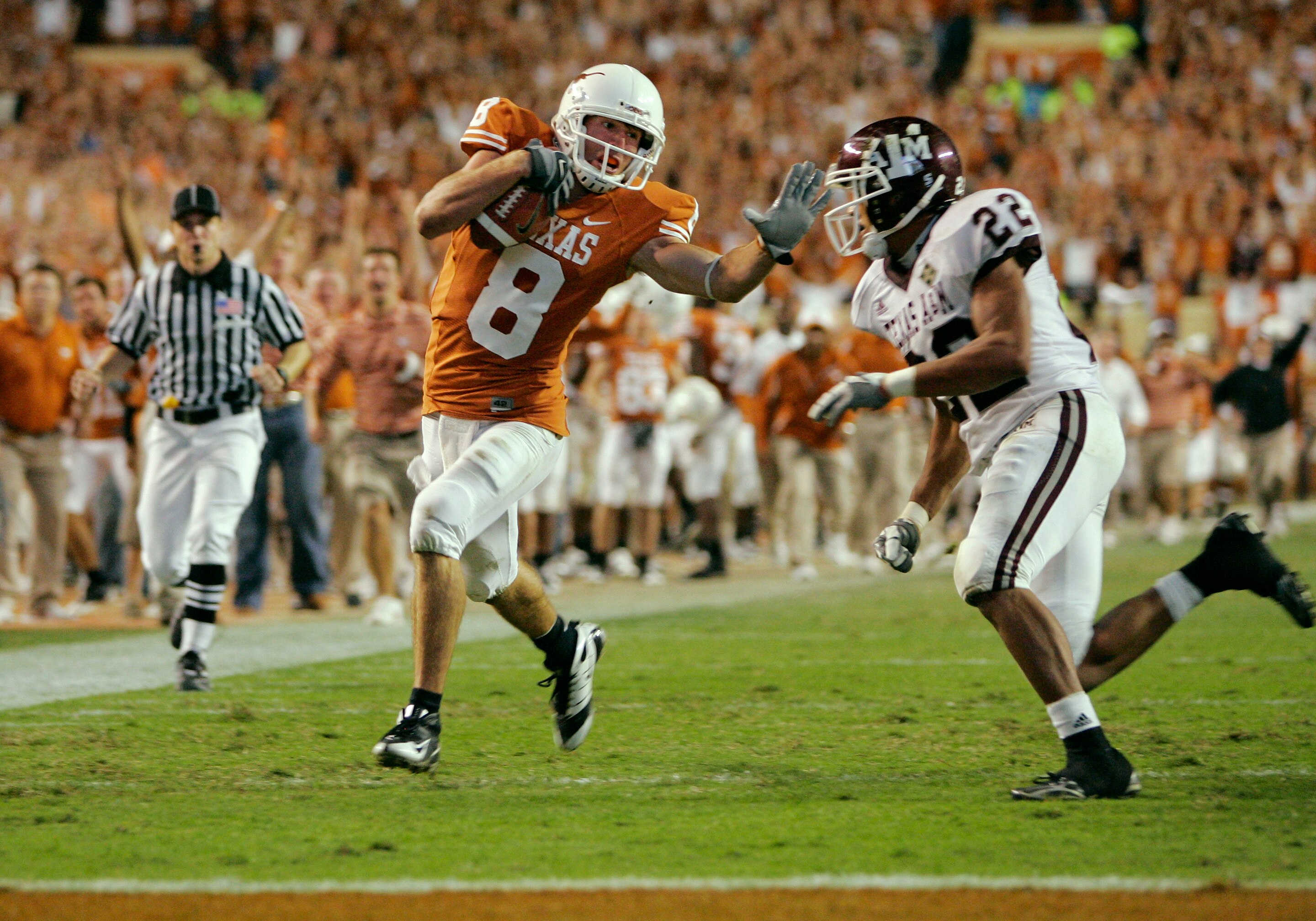 AUSTIN, TX - NOVEMBER 27:  Wide receiver Jordan Shipley #8 of the Texas Longhorns sets up a touchdown with a 68-yard gain against defensive back Trent Hunter #22 of the Texas A&M Aggies at the end of the third quarter at Darrell K Royal-Texas Memorial Sta