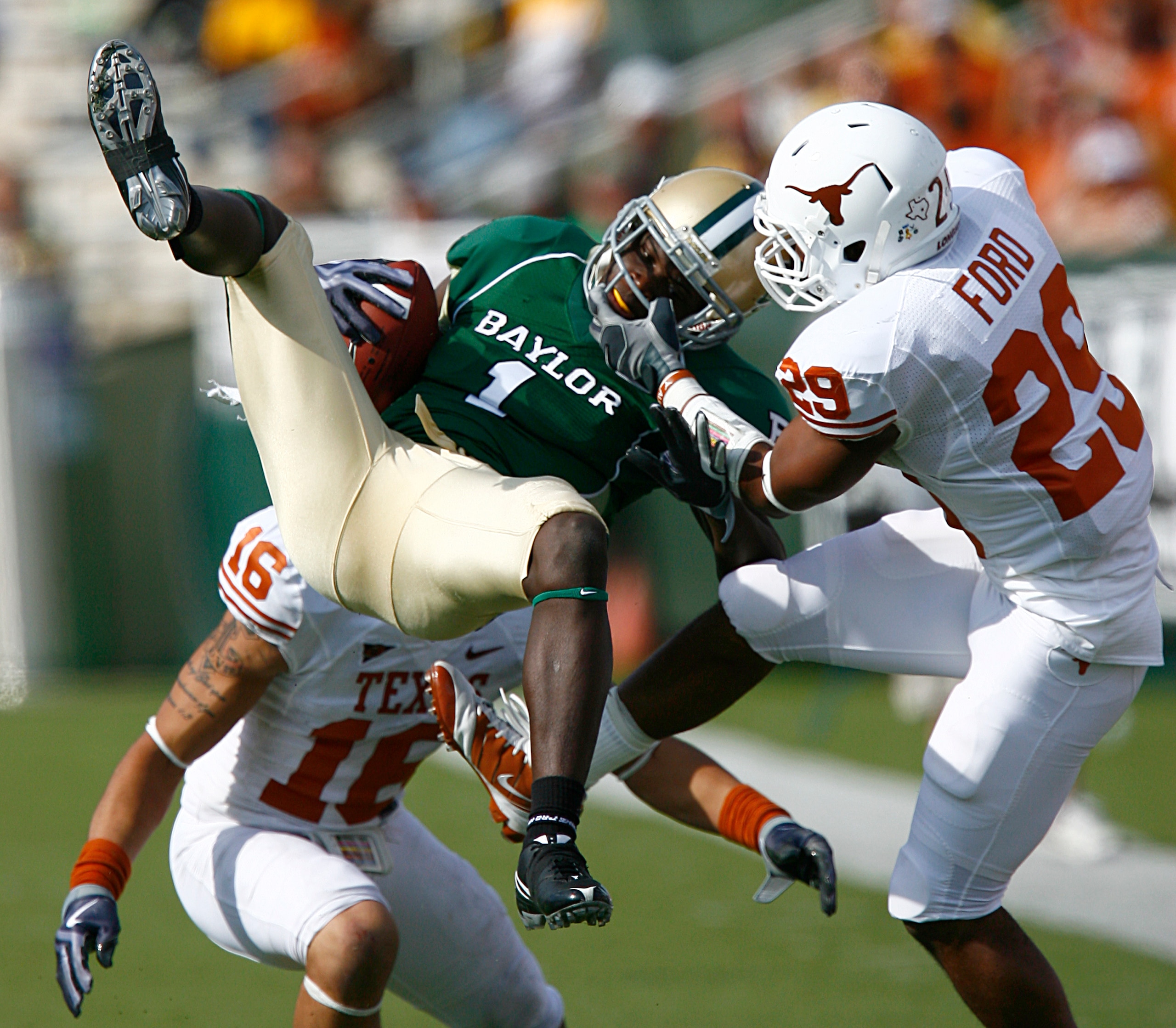 WACO, TX - NOVEMBER 14:  Inside receiver Kendall Wright #1 for the Baylor Bears pull in a pass against defensive back Clark Ford #29 for the Texas Longhorns in the second half on November 14, 2009 at Floyd Casey Stadium in Waco, Texas.  The Longhorns beat