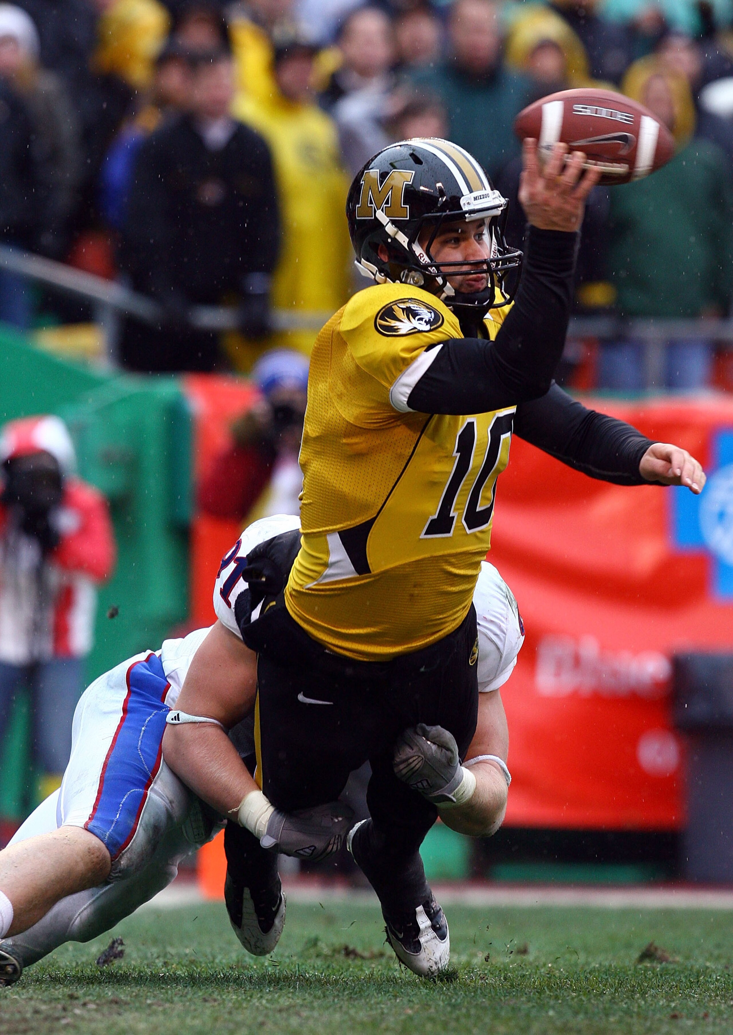 KANSAS CITY, MO - NOVEMBER 29:  Quarterback Chase Daniel #10 of the Missouri Tigers is sacked in the end-zone for a sefety by Jake Laptad #91 of the Kansas Jayhawks during the game on November 29, 2008 at Arrowhead Stadium in Kansas City, Missouri.  (Phot