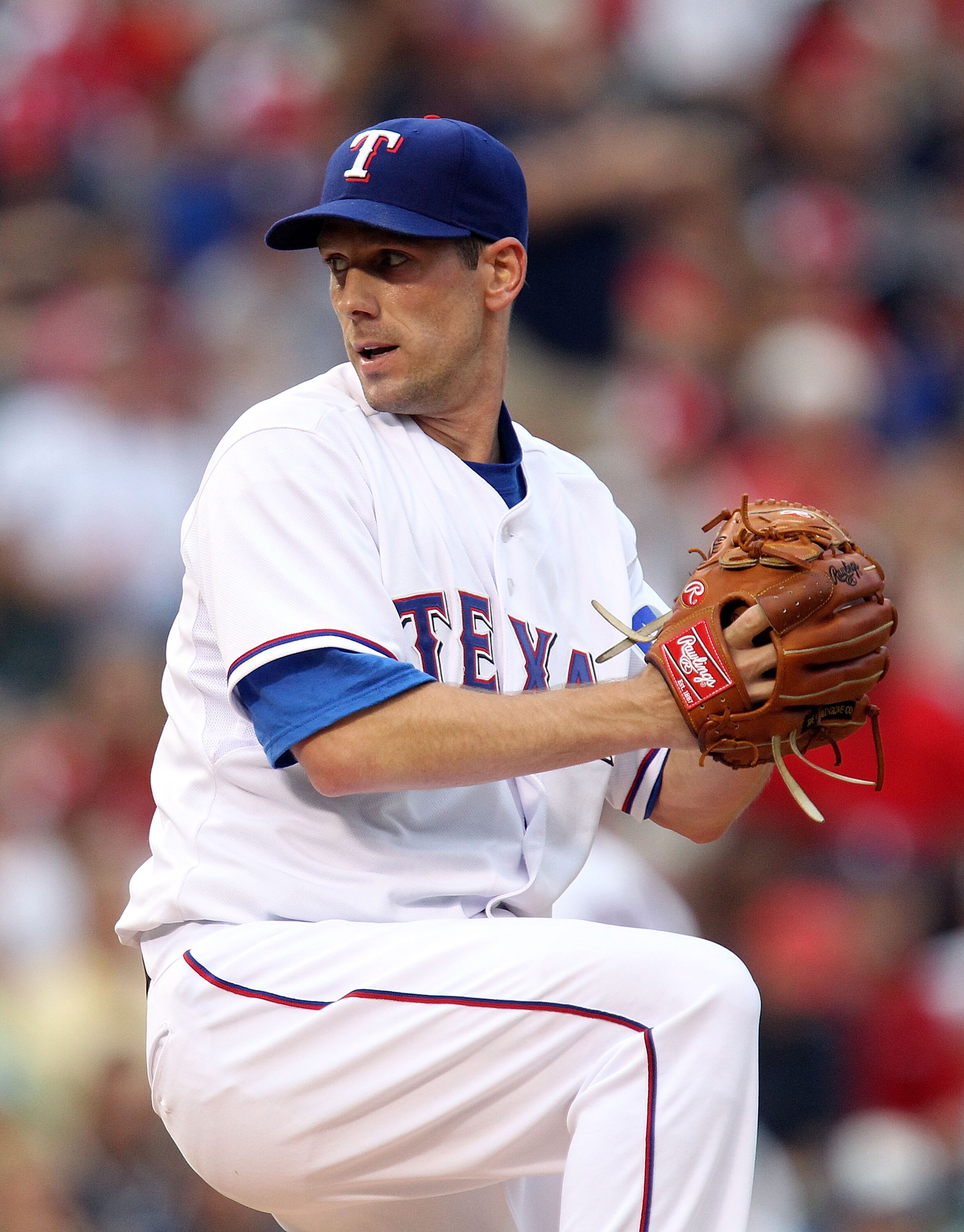 ARLINGTON, TX - JULY 10:  Pitcher Cliff Lee #33 of the Texas Rangers throws against the Baltimore Orioles on July 10, 2010 at Rangers Ballpark in Arlington, Texas.  (Photo by Ronald Martinez/Getty Images)