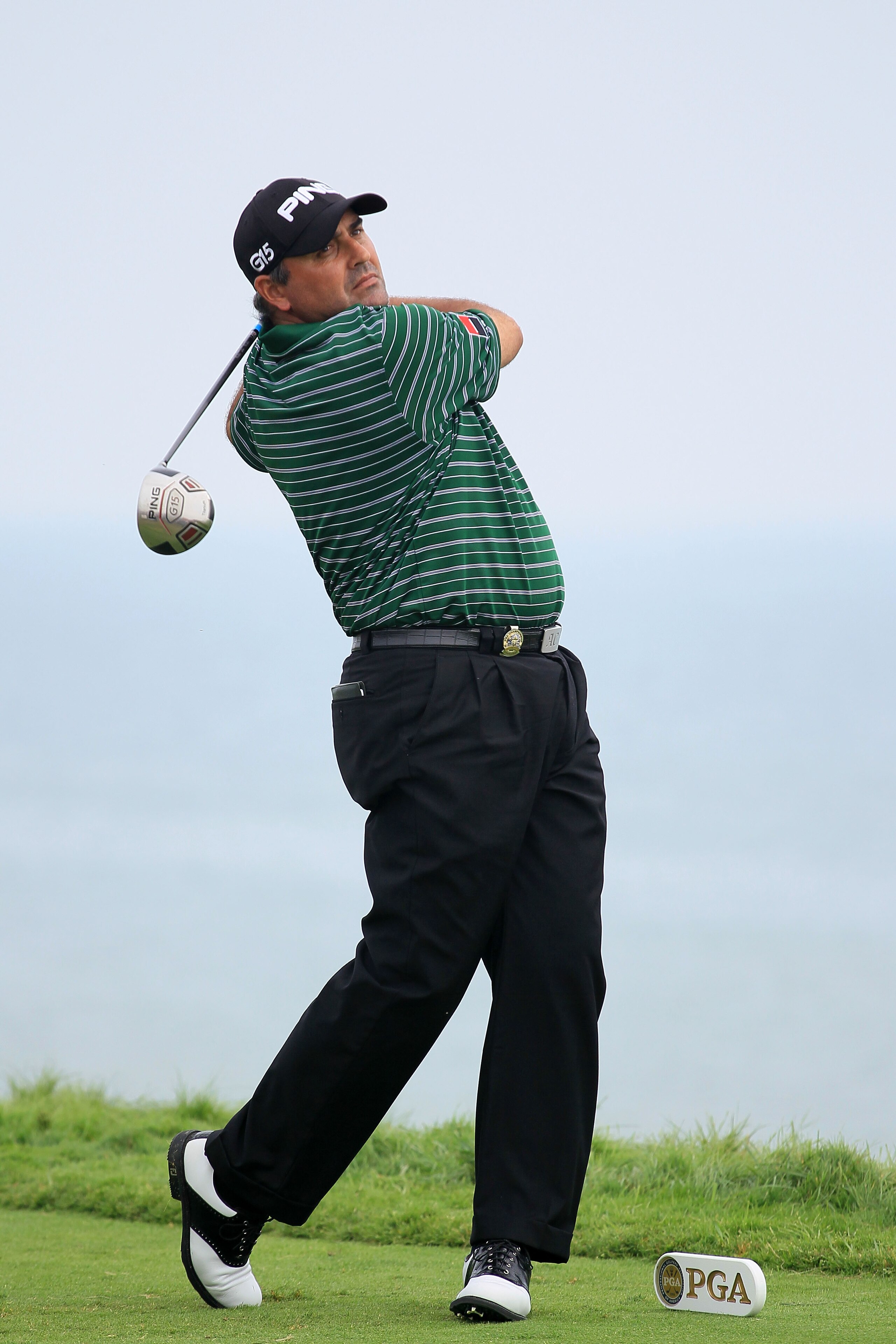 KOHLER, WI - AUGUST 13:  Angel Cabrera of Argentina hits his tee shot on the 16th hole during the continuation of the first round of the 92nd PGA Championship on the Straits Course at Whistling Straits on August 13, 2010 in Kohler, Wisconsin.  (Photo by A