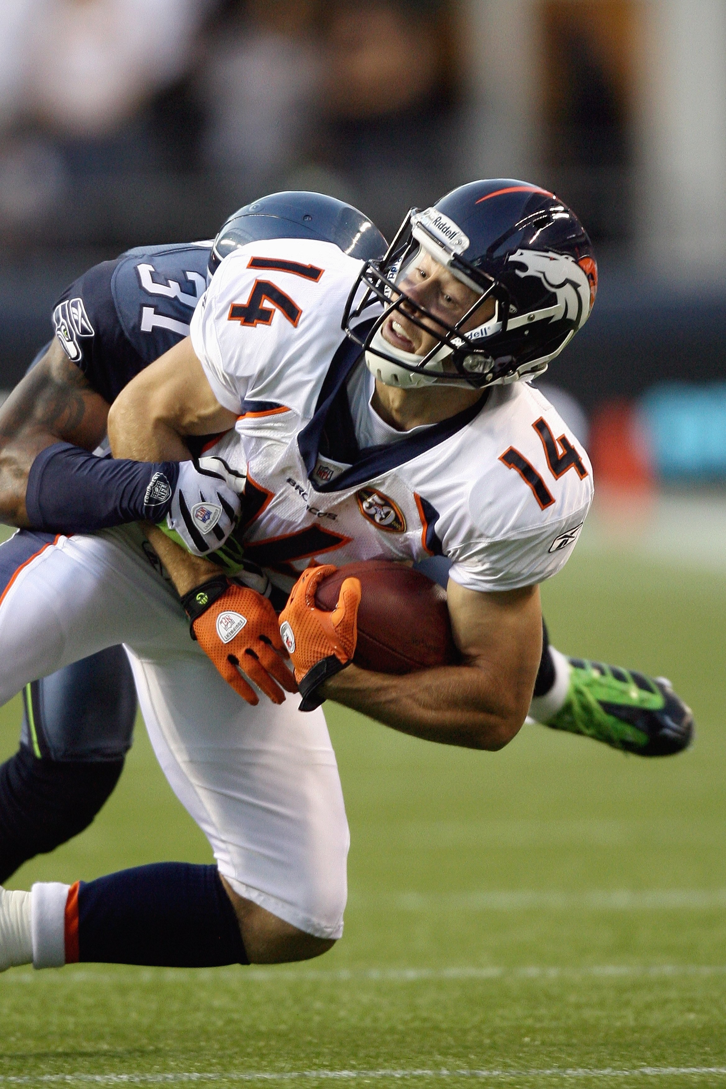 SEATTLE - AUGUST 22: Quarterback Brandon Stokley #14 of the Denver Broncos is sacked during the game against the Seattle Seahawks on August 22, 2009 at Qwest Field in Seattle, Washington. (Photo by Otto Greule Jr/Getty Images)