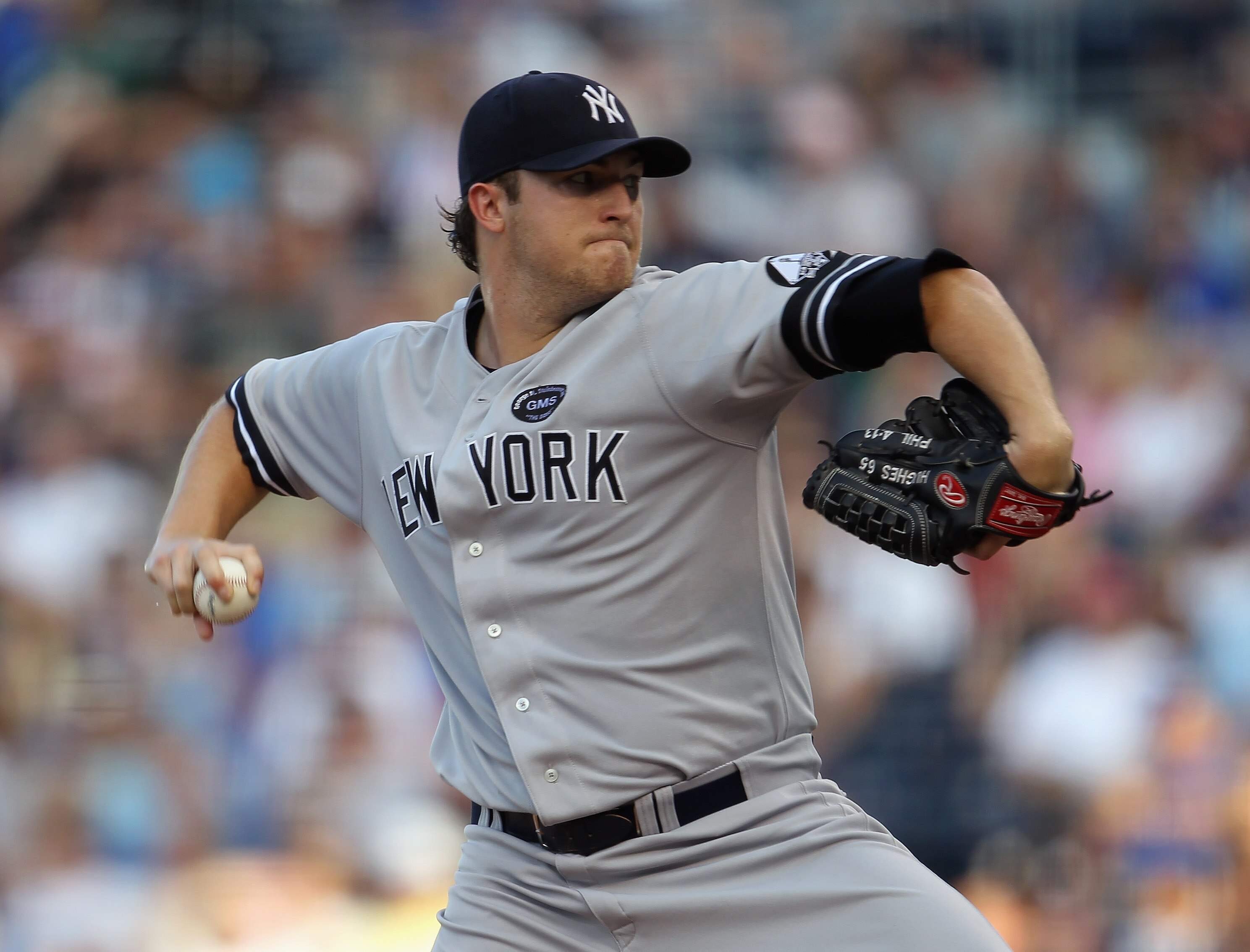 KANSAS CITY, MO - AUGUST 14:  Starting pitcher Phil Hughes #65 of the New York Yankees pitches during the game against the Kansas City Royals on August 14, 2010 at Kauffman Stadium in Kansas City, Missouri.  (Photo by Jamie Squire/Getty Images)