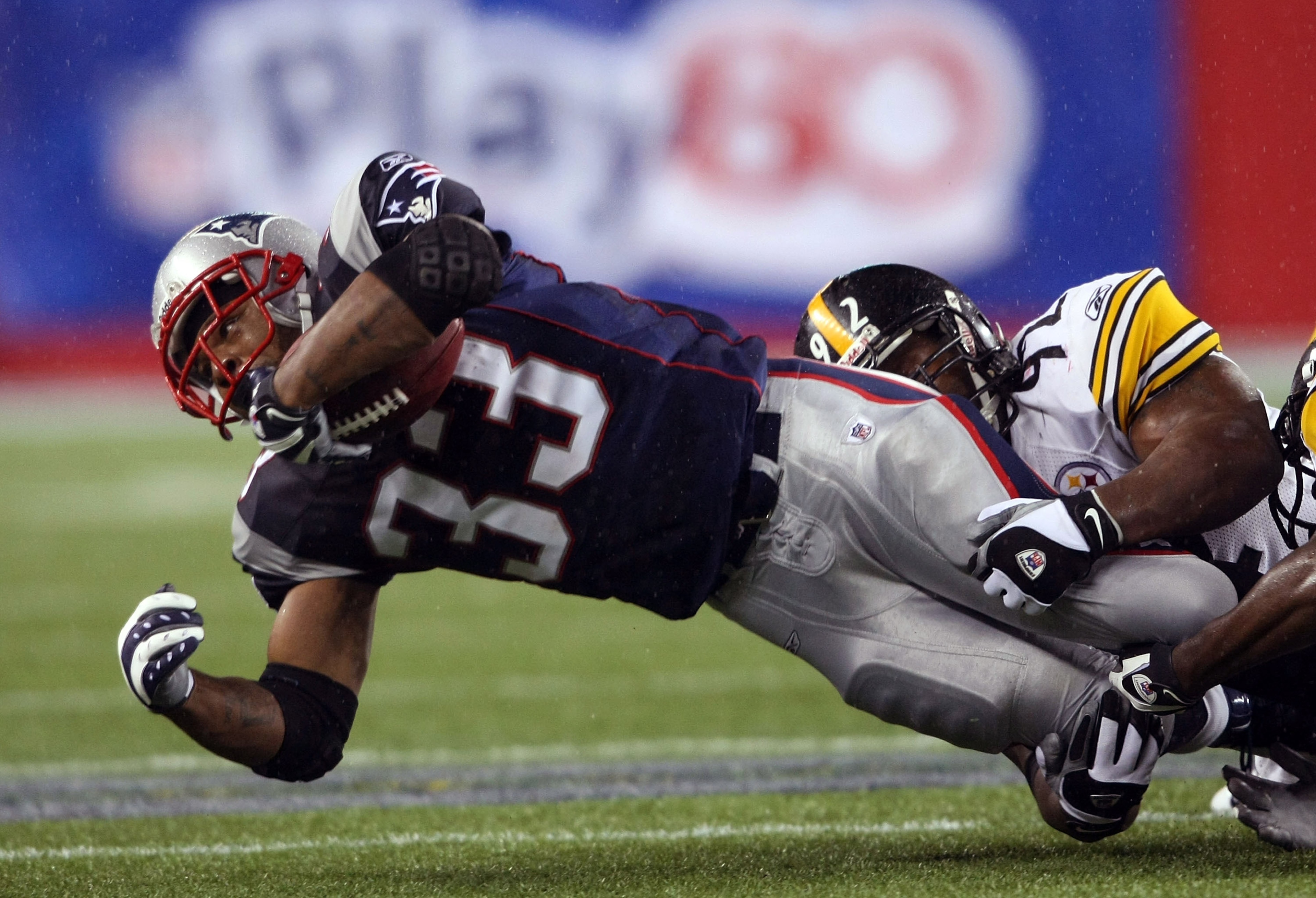 FOXBORO, MA - NOVEMBER 30: Kevin Faulk #33 of the New England Patriots is taken down by James Harrison #92 of the Pittsburgh Steelers on November 30, 2008 at Gillette Stadium in Foxboro, Massachusetts. (Photo by Elsa/Getty Images) FOXBORO, MA - NOVEMBER 30: Kevin Faulk #33 of the New England Patriots is taken down by James Harrison #92 of the Pittsburgh Steelers on November 30, 2008 at Gillette Stadium in Foxboro, Massachusetts. (Photo by Elsa/Getty Images)