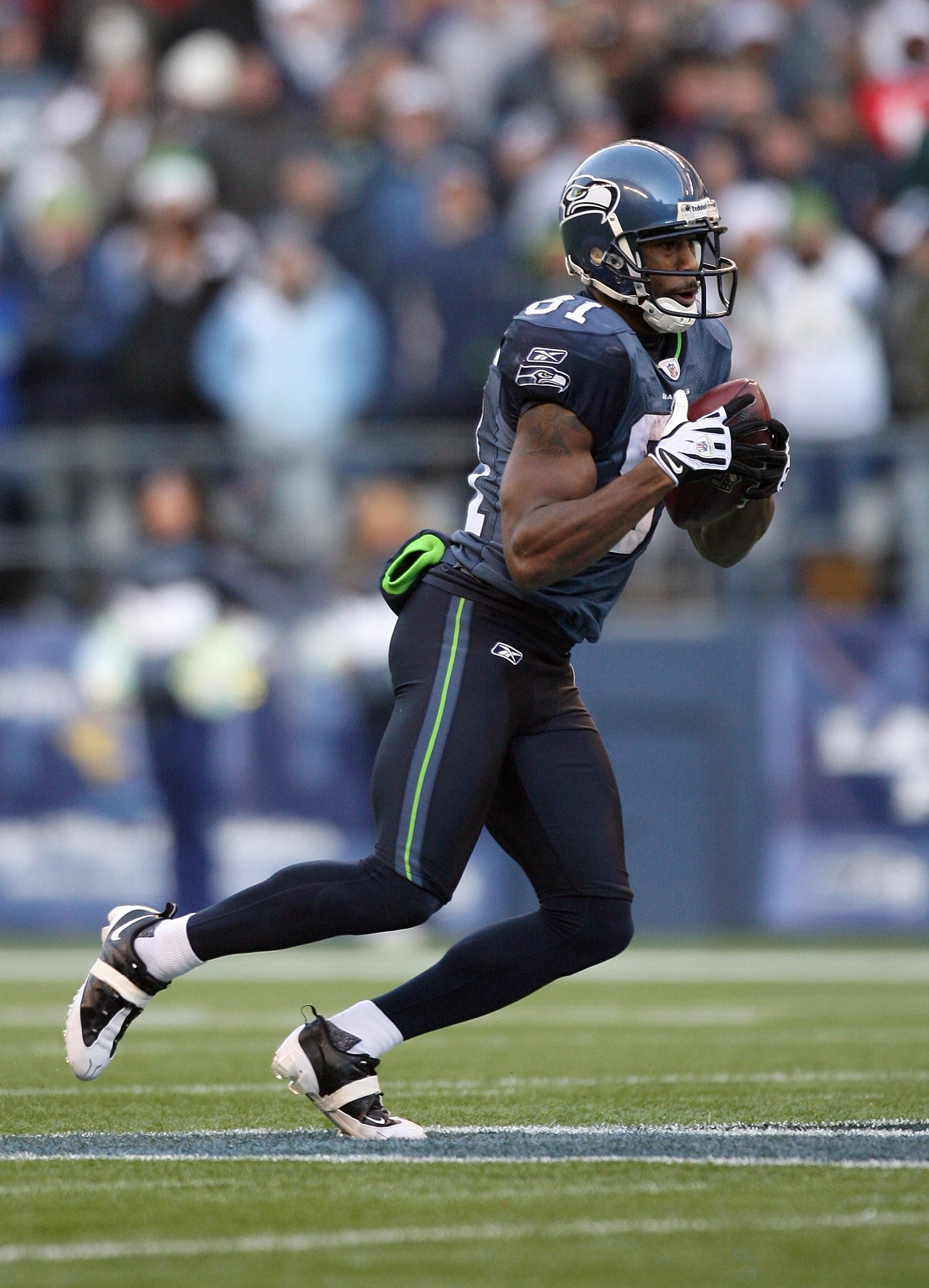 SEATTLE - DECEMBER 6:  Nate Burleson #81 of the Seattle Seahawks looks to run with the ball during their NFL game against the San Francisco 49ers on December 6, 2009 at Qwest Field in Seattle, Washington. The Seahawks defeated the 49ers 20-17. (Photo by O