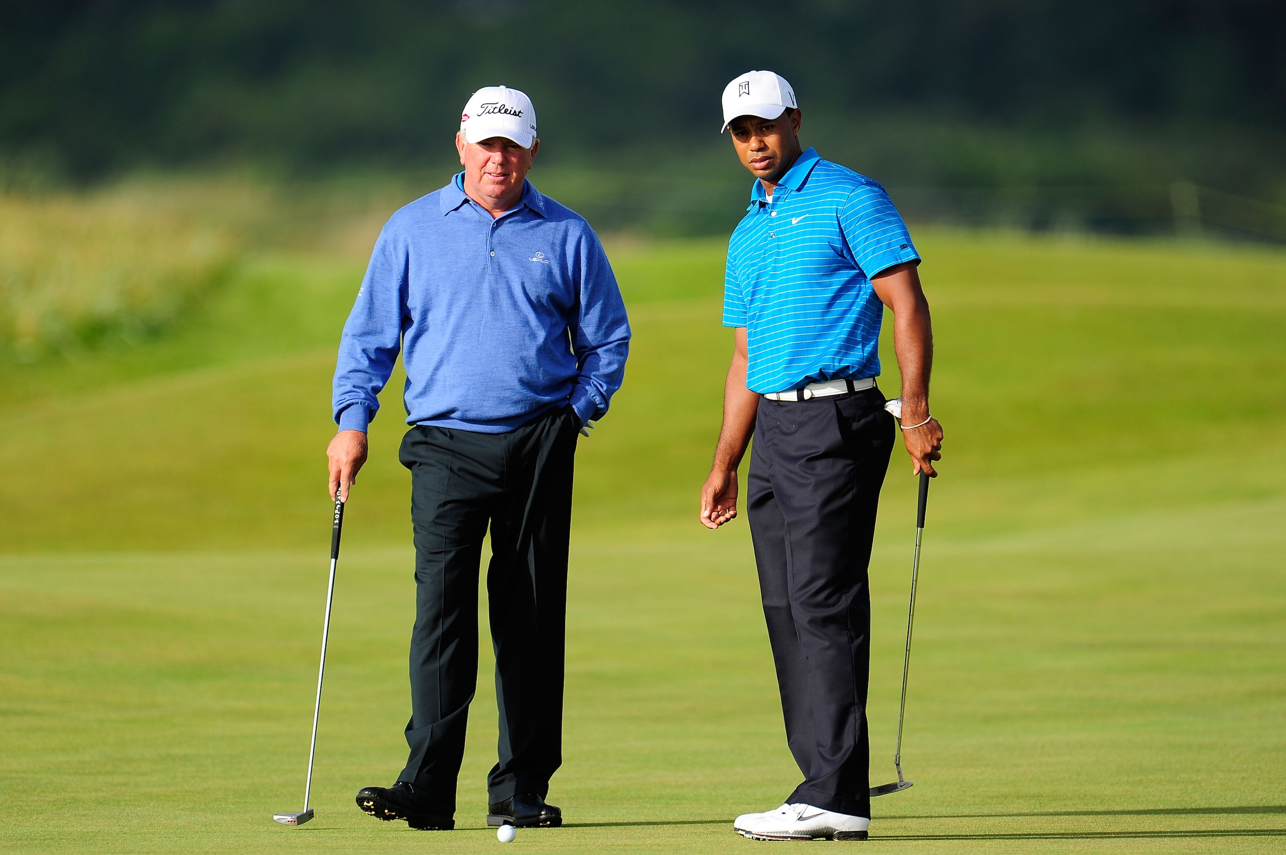 ST ANDREWS, SCOTLAND - JULY 13: Mark O'Meara (L) and Tiger Woods of the United States practice putting during practice for the 139th Open Championship on the Old Course, St Andrews on July 13, 2010 in St Andrews, Scotland. (Photo by Stuart Franklin/Gett ST ANDREWS, SCOTLAND - JULY 13: Mark O'Meara (L) and Tiger Woods of the United States practice putting during practice for the 139th Open Championship on the Old Course, St Andrews on July 13, 2010 in St Andrews, Scotland. (Photo by Stuart Franklin/Gett