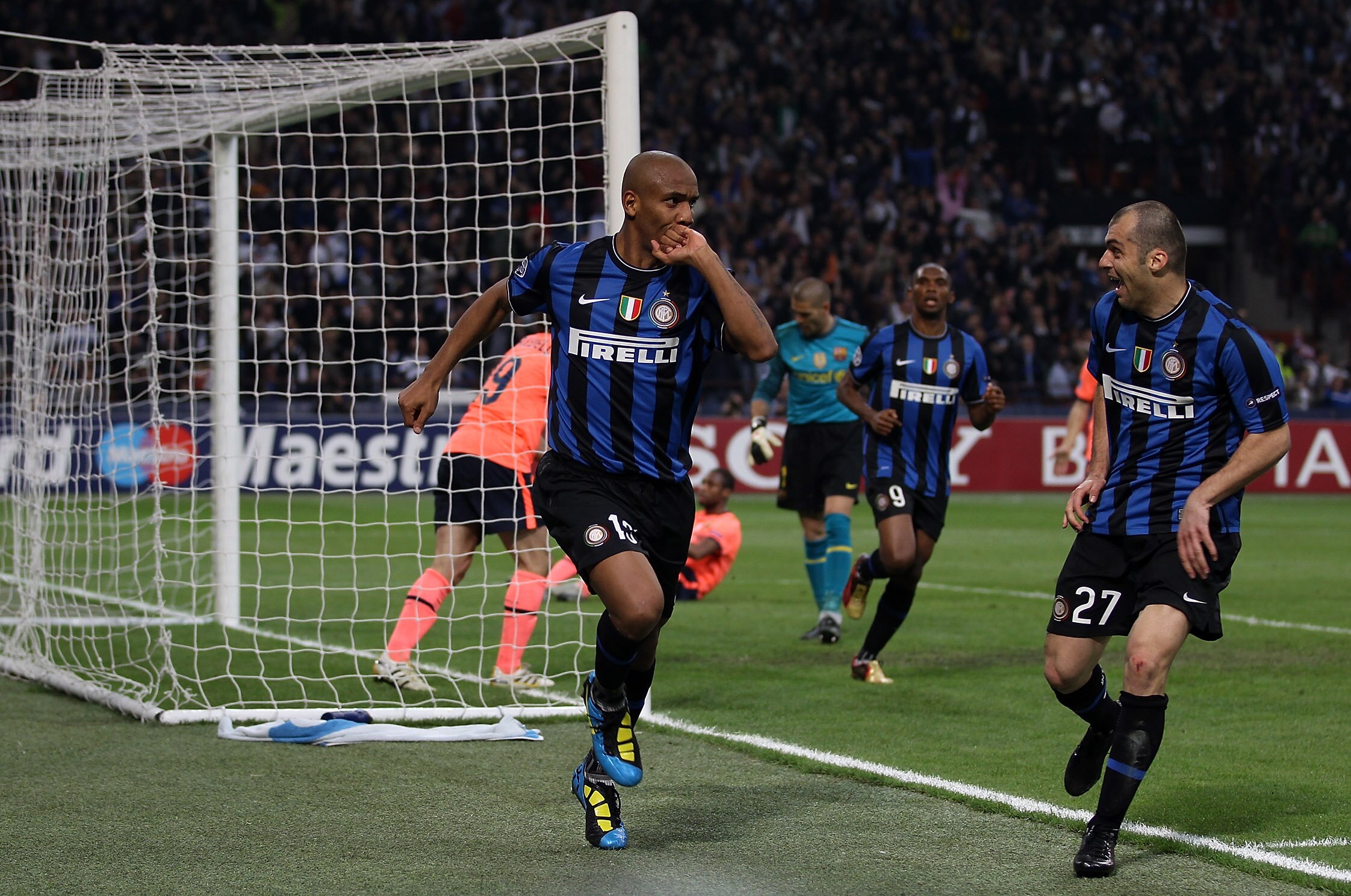 MILAN, ITALY - APRIL 20: Maicon (C) of Inter celebrates with teammate Goran Pandev (R) after scoring the 2:1 goal during the UEFA Champions League Semi Final 1st Leg match between Inter Milan and Barcelona at the San Siro on April 20, 2010 in Milan, Ital MILAN, ITALY - APRIL 20: Maicon (C) of Inter celebrates with teammate Goran Pandev (R) after scoring the 2:1 goal during the UEFA Champions League Semi Final 1st Leg match between Inter Milan and Barcelona at the San Siro on April 20, 2010 in Milan, Ital