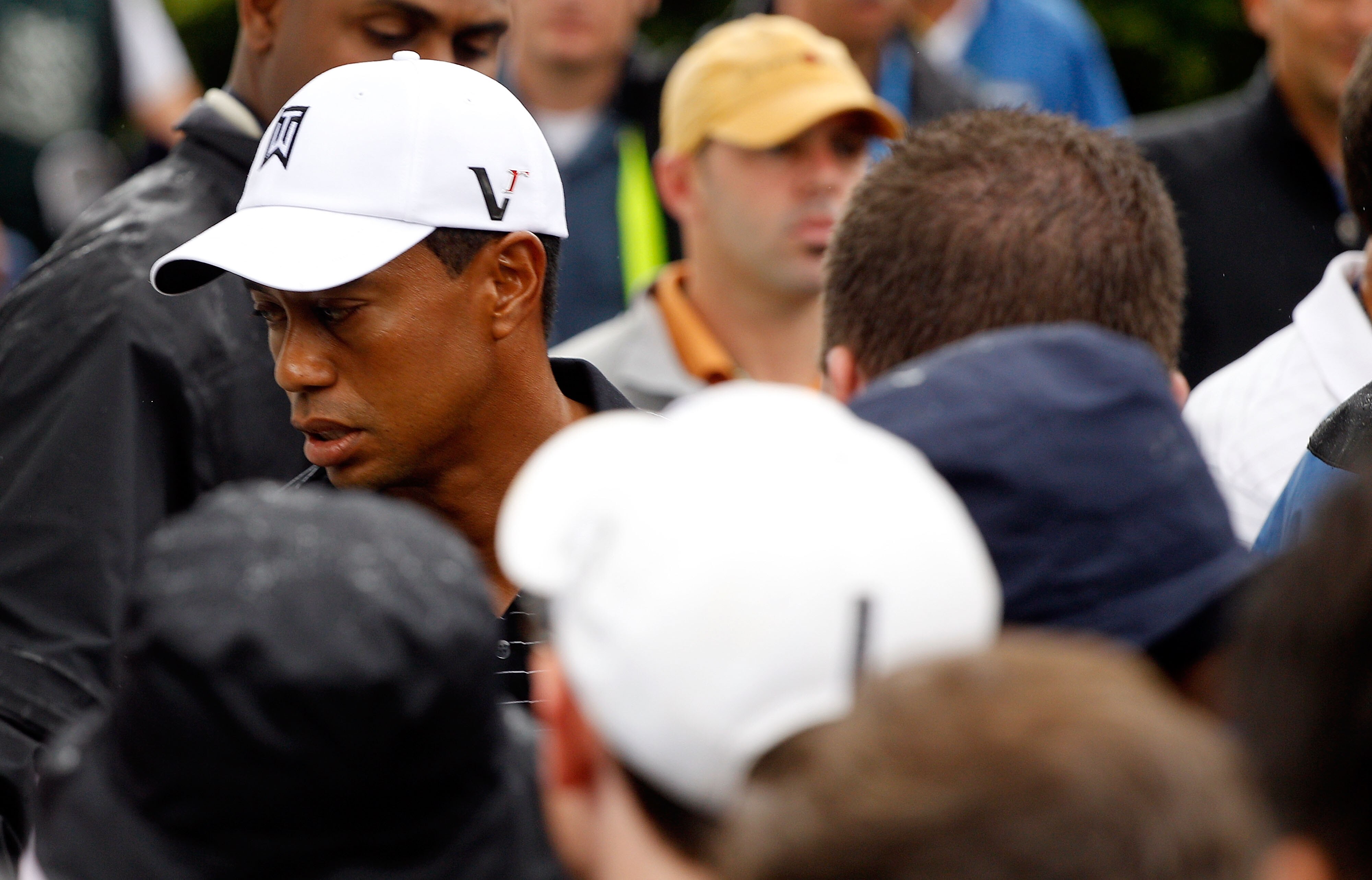 PARAMUS, NJ - AUGUST 25:  Tiger Woods walks past the media on the way to a press conference after the pro-am, prior to the start of The Barclays at the Ridgewood Country Club on August 25, 2010 in Paramus, New Jersey.  (Photo by Scott Halleran/Getty Image