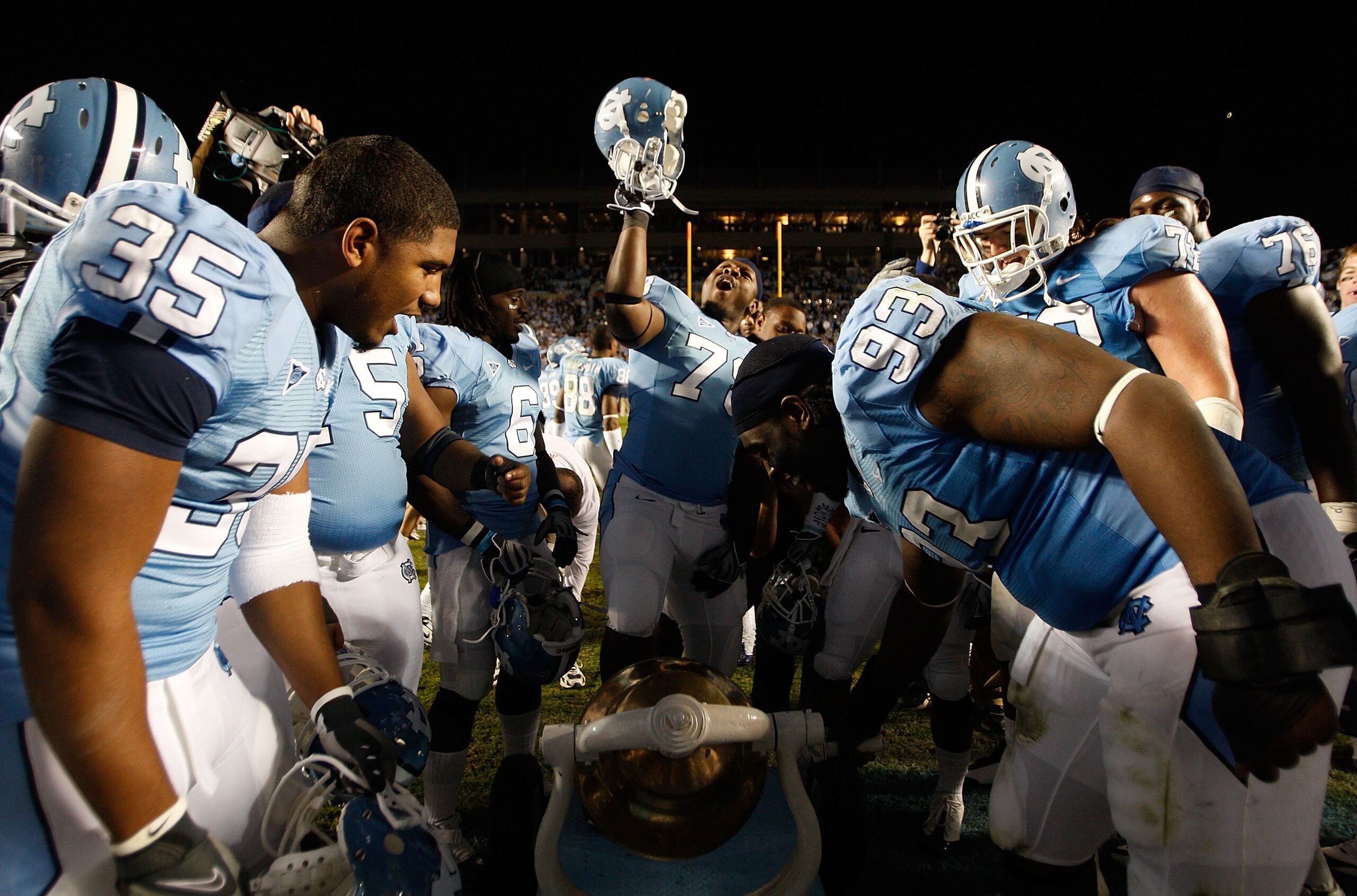 CHAPEL HILL, NC - NOVEMBER 07:  The North Carolina Tar Heels celebrate by ringing the bell after a 19-6 victory over the Duke Blue Devils during their game at Kenan Stadium on November 7, 2009 in Chapel Hill, North Carolina.  (Photo by Streeter Lecka/Gett