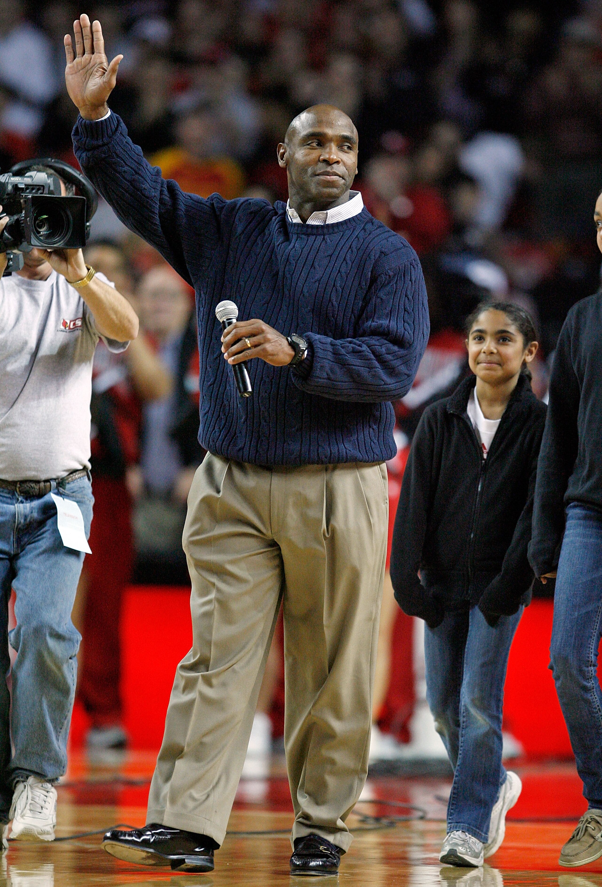 LOUISVILLE, KY - DECEMBER 12: Charlie Strong the new football Head Coach of the Louisville Cardinals is pictured during the Louisville basketball game against the Western Carolina Catamounts on December 12, 2009 at Freedom Hall in Louisville, Kentucky. LOUISVILLE, KY - DECEMBER 12: Charlie Strong the new football Head Coach of the Louisville Cardinals is pictured during the Louisville basketball game against the Western Carolina Catamounts on December 12, 2009 at Freedom Hall in Louisville, Kentucky.