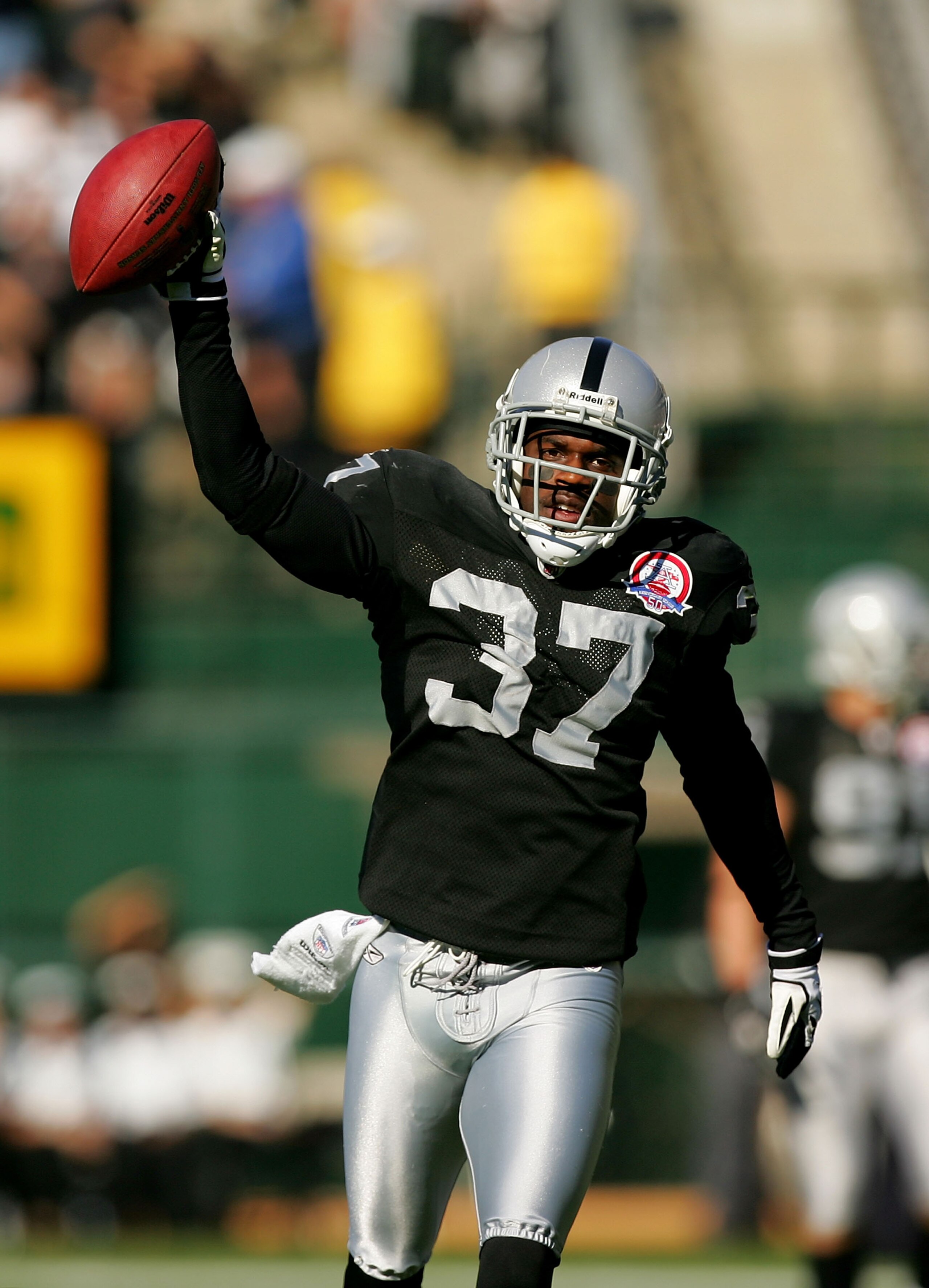 OAKLAND, CA - NOVEMBER 15: Chris Johnson #37 of the Oakland Raiders celebrates after intercepting the ball during their game against the Kansas City Chiefs at Oakland-Alameda County Coliseum on November 15, 2009 in Oakland, California.  (Photo by Ezra Sha