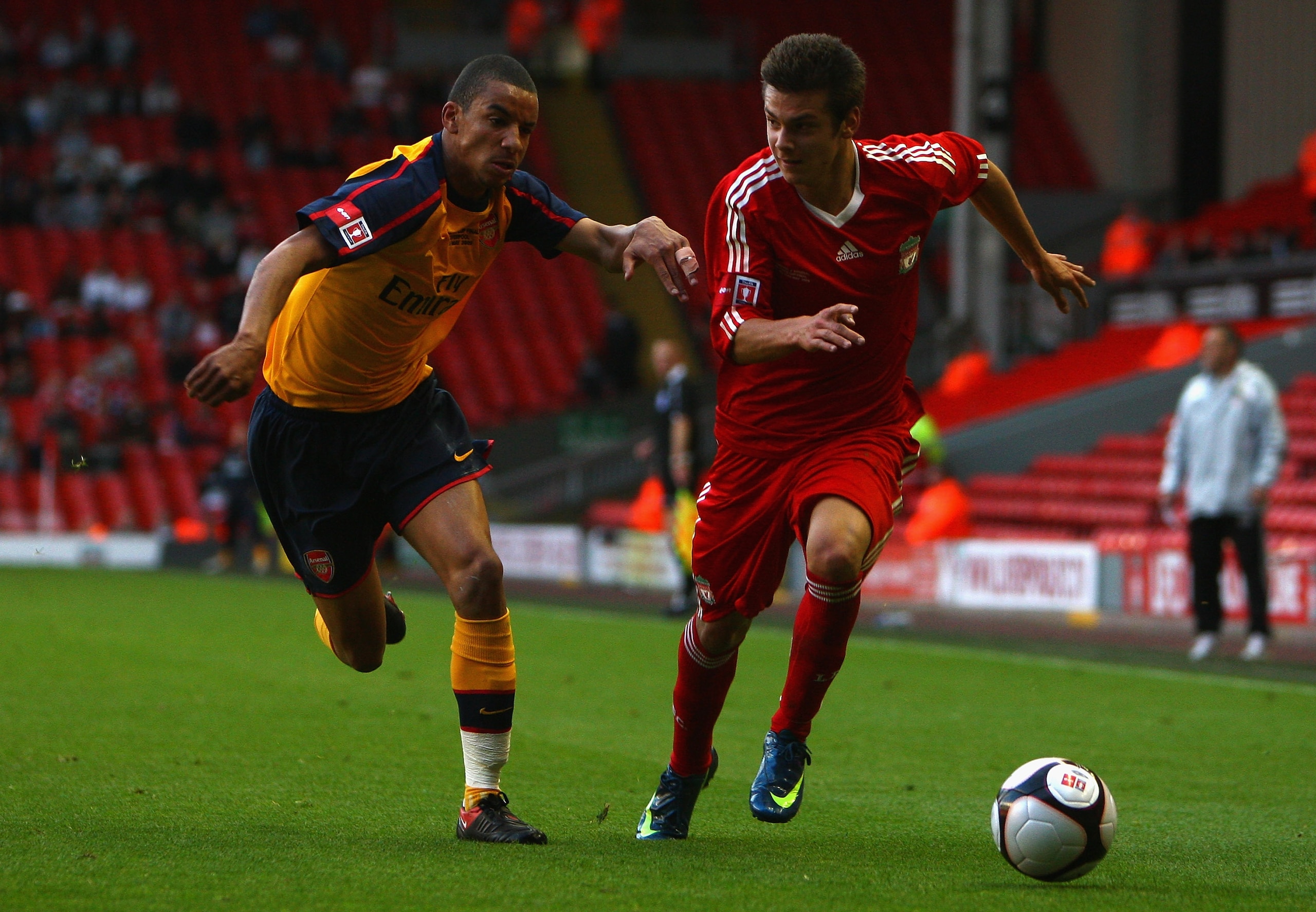 LIVERPOOL, ENGLAND - MAY 26:  Alexander Kacaniklic of Liverpool battles with Craig Eastmond of Arsenal during the second leg of the FA Youth Cup final sponsored by E.ON, between Liverpool and Arsenal at Anfield on May 26, 2009 in Liverpool, England.  (Pho