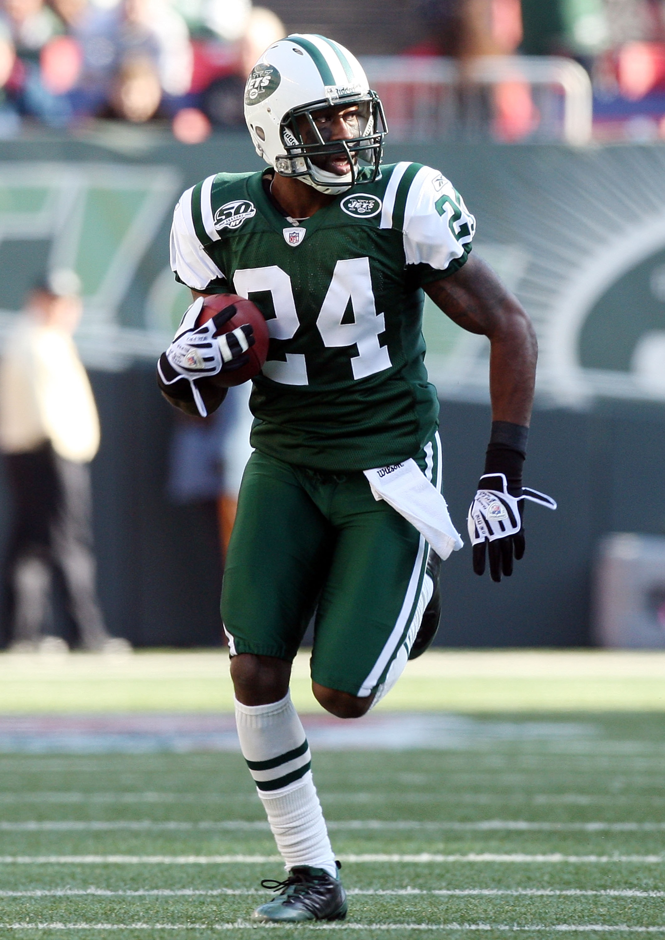EAST RUTHERFORD, NJ - NOVEMBER 29:  Darrelle Revis #24 of the New York Jets runs the ball in for a first quarter touchdown after an interception against the Carolina Panthers on November 29, 2009 at Giants Stadium in East Rutherford, New Jersey.  (Photo b
