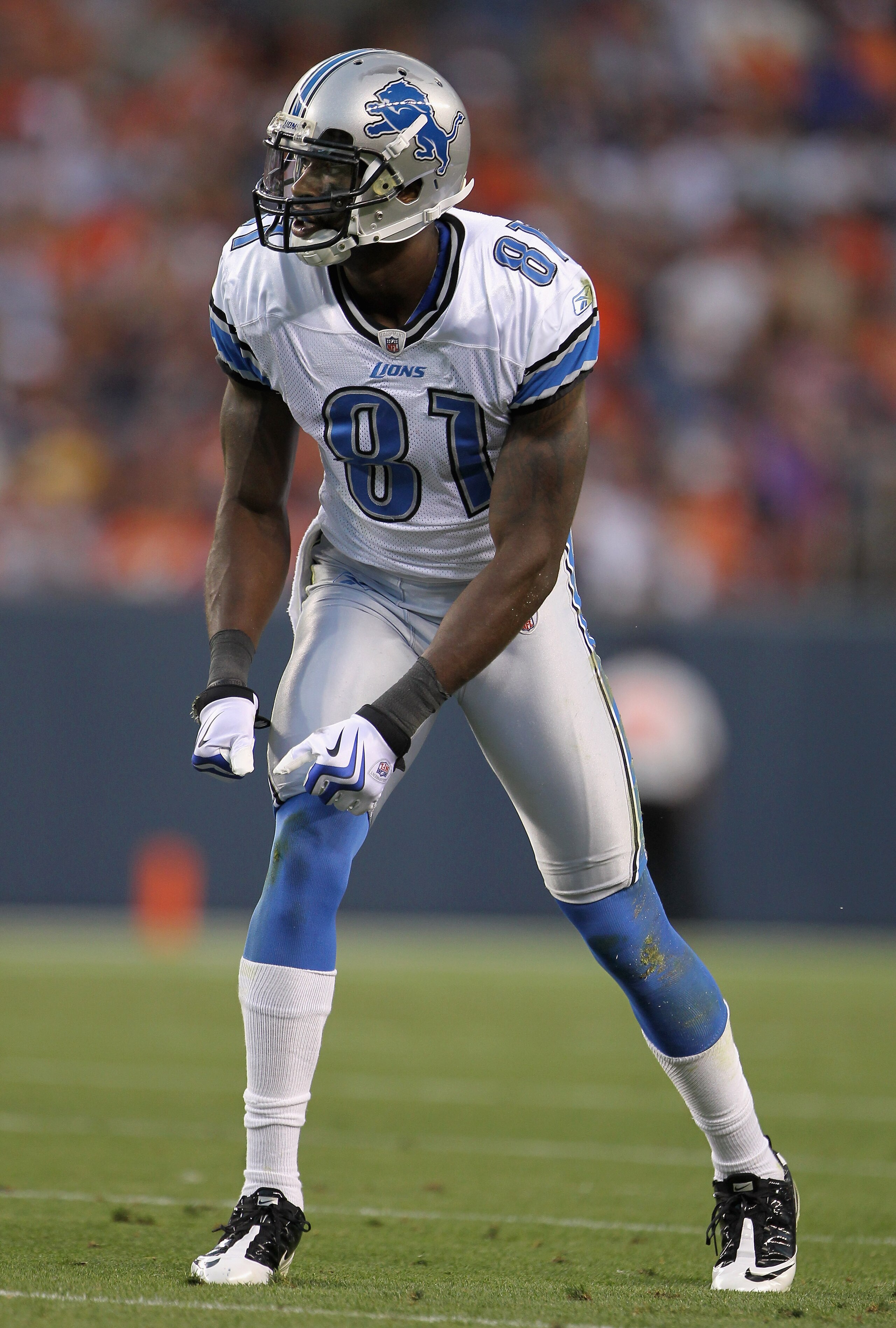 DENVER - AUGUST 21:  Wide receiver Calvin Johnson #81 of the Detroit Lions awaits the snap on the line of scrimmage against the Denver Broncos during preseason NFL action at INVESCO Field at Mile High on August 21, 2010 in Denver, Colorado. The Lions defe