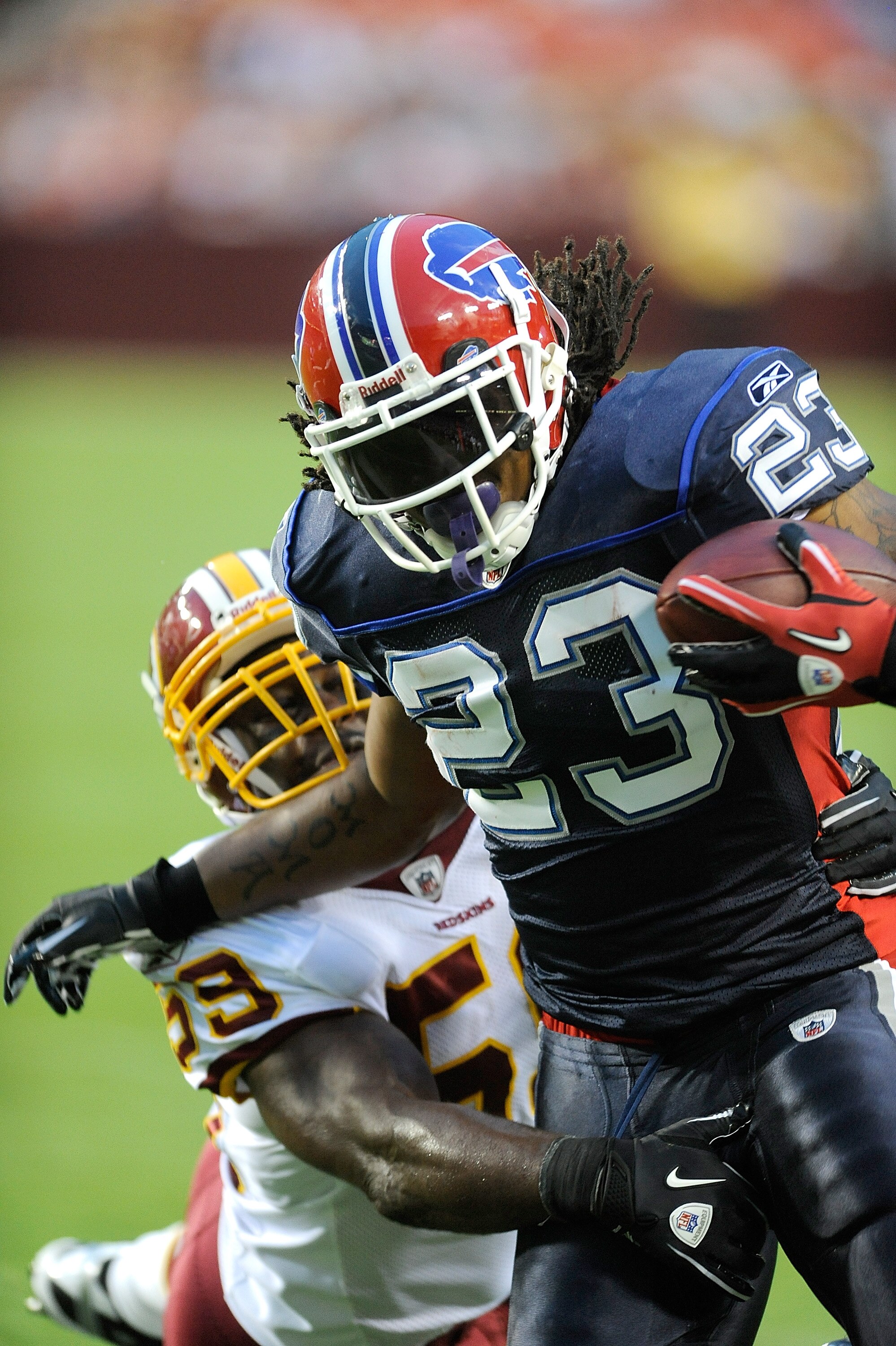 LANDOVER, MD - AUGUST 13:  Marshawn Lynch #23 of the Buffalo Bills is tackled during the preseason game by London Fletcher #59 of the Washington Redskins at FedEx Field on August 13, 2010 in Landover, Maryland.  (Photo by Greg Fiume/Getty Images)
