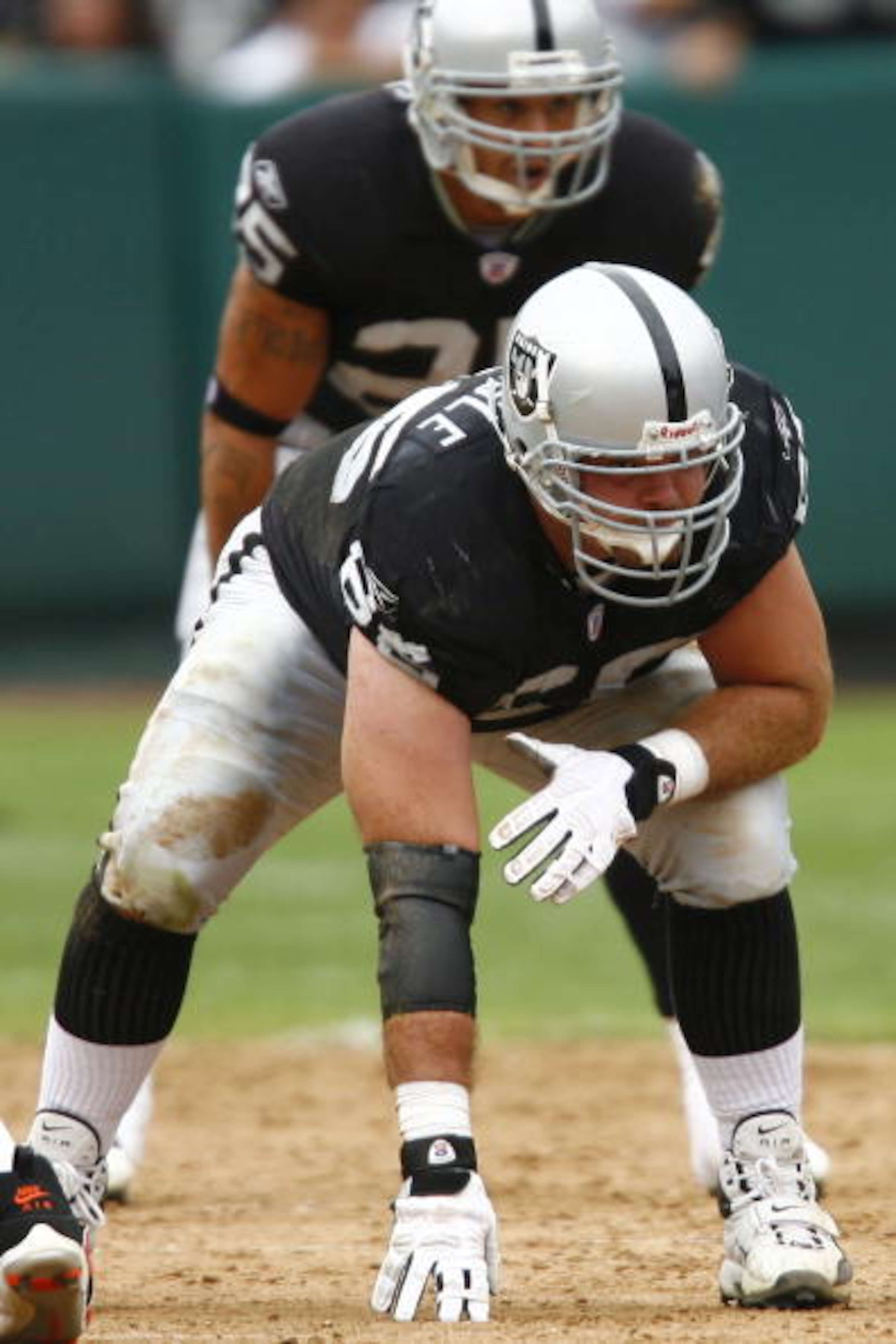 OAKLAND, CA - SEPTEMBER 23: Guard Cooper Carlisle #66 of the Oakland Raiders is set in a three-point stance against the Cleveland Browns during a 26-24 win at McAfee Coliseum on September 23, 2007 in Oakland, California. (Photo by Kevin Terrell/Getty Im OAKLAND, CA - SEPTEMBER 23: Guard Cooper Carlisle #66 of the Oakland Raiders is set in a three-point stance against the Cleveland Browns during a 26-24 win at McAfee Coliseum on September 23, 2007 in Oakland, California. (Photo by Kevin Terrell/Getty Im
