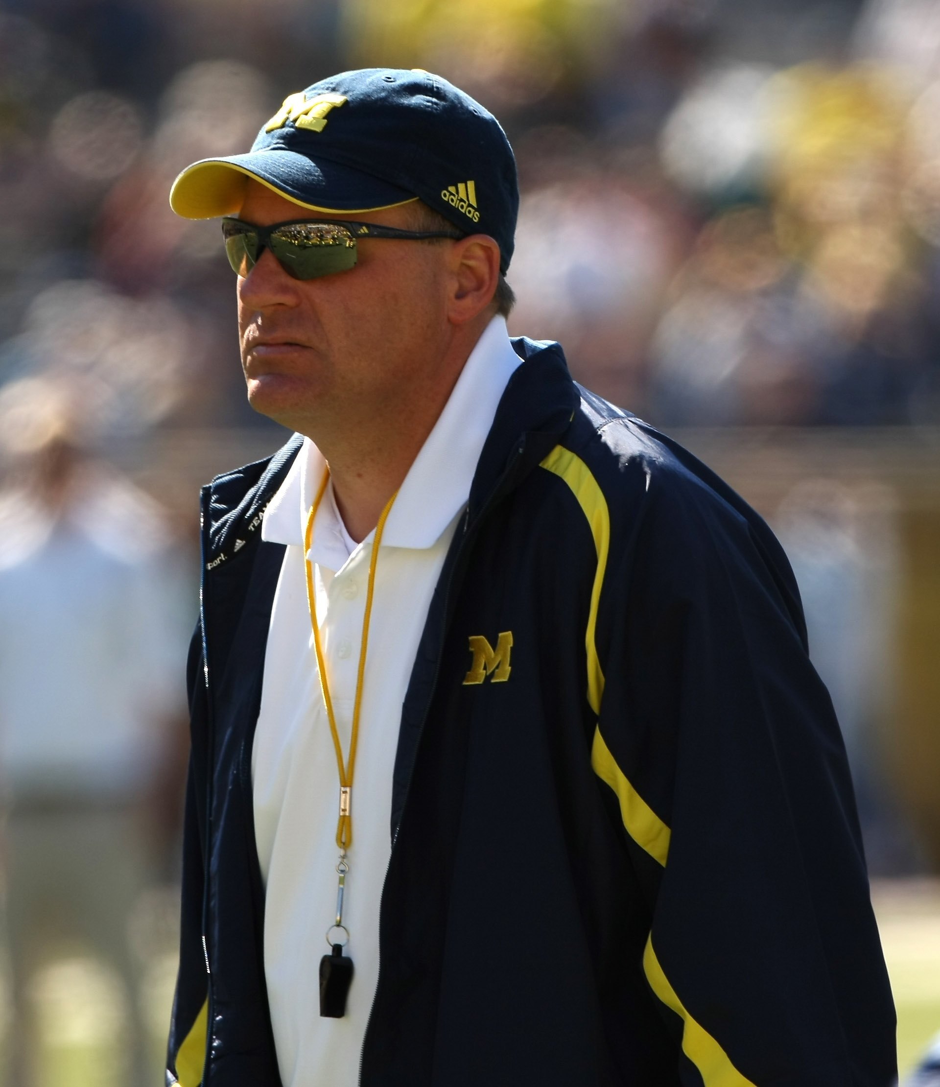 ANN ARBOR, MI - SEPTEMBER 19:  Head coach Rich Rodriguez of the Michigan Wolverines watches warmups before the game with the Eastern Michigan Eagles at Michigan Stadium on September 19, 2009 in Ann Arbor, Michigan.  Michigan won 45-17.  (Photo by Stephen