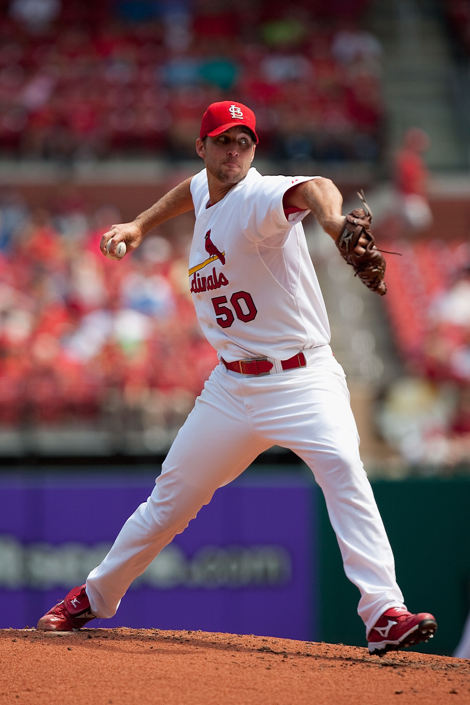 ST. LOUIS - AUGUST 18: Starting pitcher Adam Wainwright #50 of the St. Louis Cardinals throws to first base against the Milwaukee Brewers  at Busch Stadium on August 18, 2010 in St. Louis, Missouri.  The Brewers beat the Cardinals 3-2.  (Photo by Dilip Vi