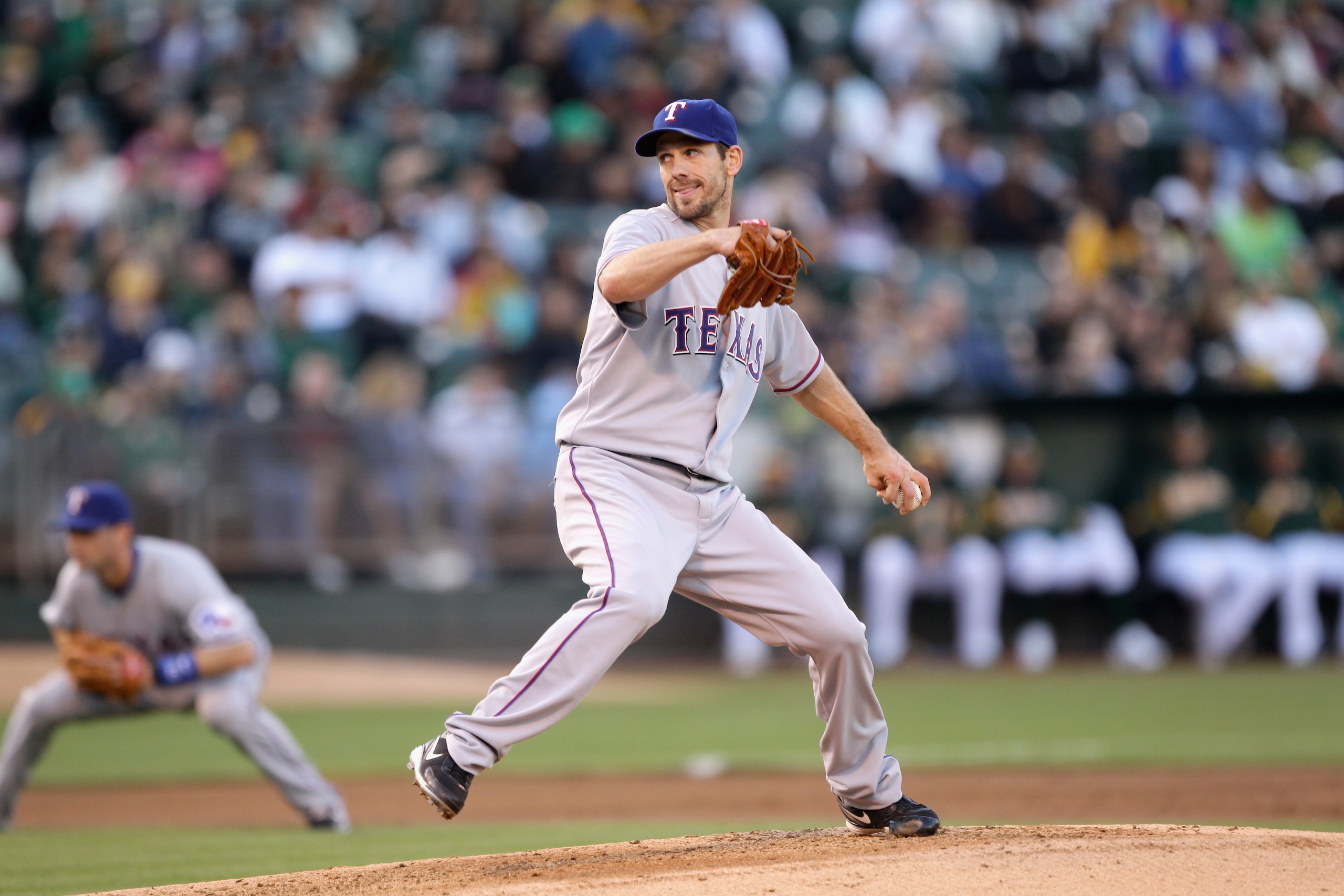 OAKLAND, CA - AUGUST 06:  Cliff Lee #33 of the Texas Rangers pitches against the Oakland Athletics at the Oakland-Alameda County Coliseum on August 6, 2010 in Oakland, California.  (Photo by Ezra Shaw/Getty Images)