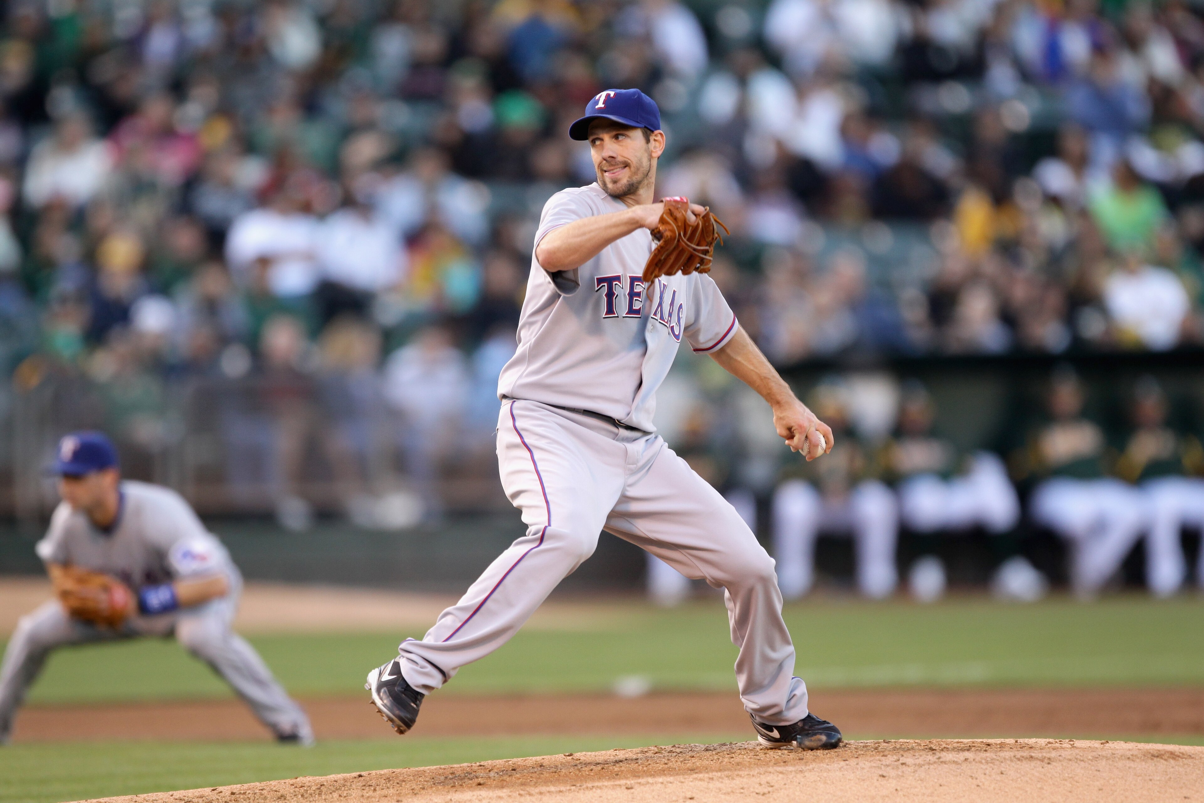 OAKLAND, CA - AUGUST 06:  Cliff Lee #33 of the Texas Rangers pitches against the Oakland Athletics at the Oakland-Alameda County Coliseum on August 6, 2010 in Oakland, California.  (Photo by Ezra Shaw/Getty Images)
