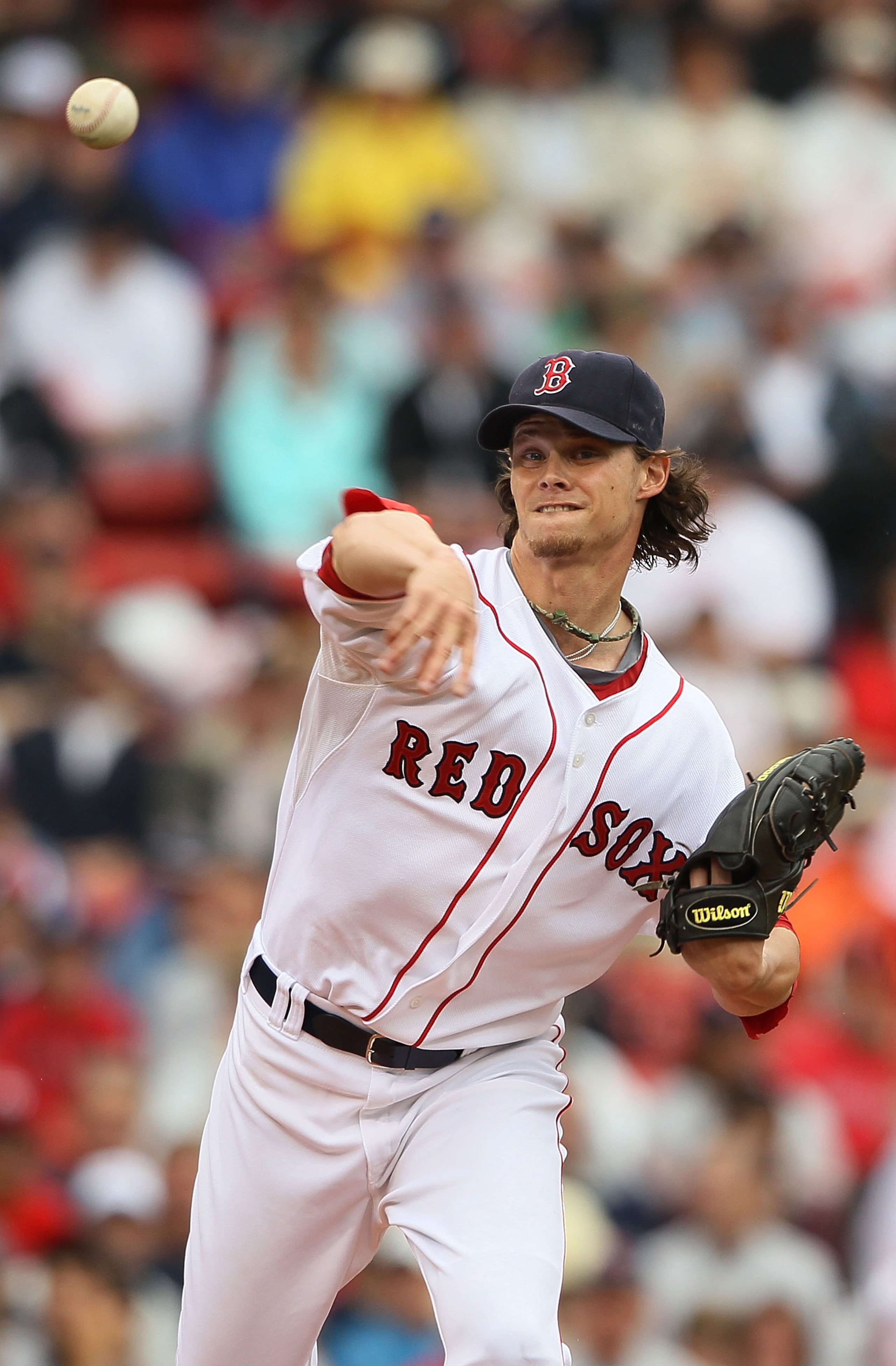 BOSTON - AUGUST 22:  Clay Buchholz #11 of the Boston Red Sox throws the ball back to first base in the first inning against the Toronto Blue Jays on August 22, 2010 at Fenway Park in Boston, Massachusetts.  (Photo by Elsa/Getty Images)