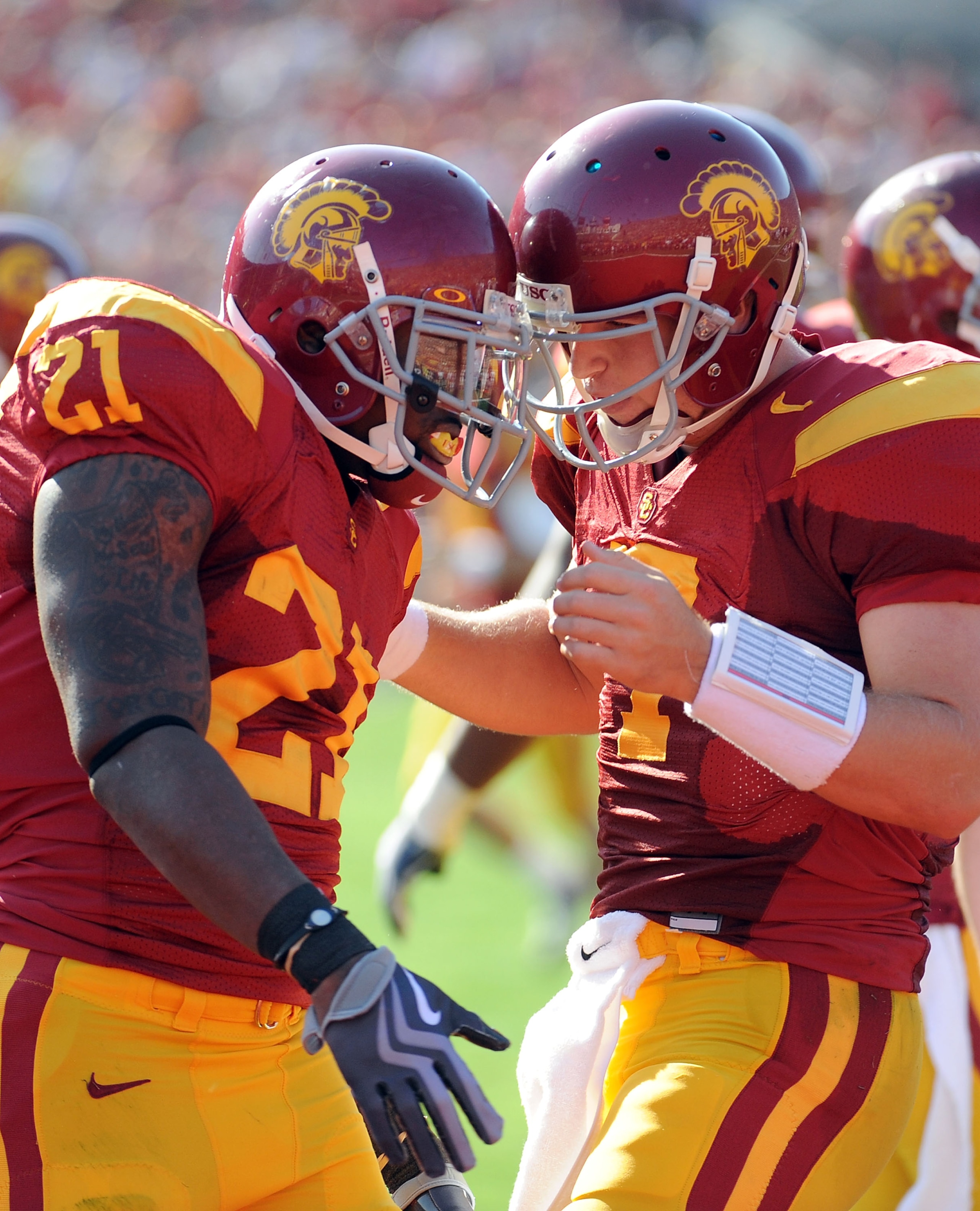 LOS ANGELES, CA - NOVEMBER 14:  Matt Barkley #7 and Allen Bradford #21 of the USC Trojans celebrate a touchdown to trail the Stanford Cardinal 14-7 during the first half at the Los Angeles Memorial Coliseum on November 14, 2009 in Los Angeles, California.