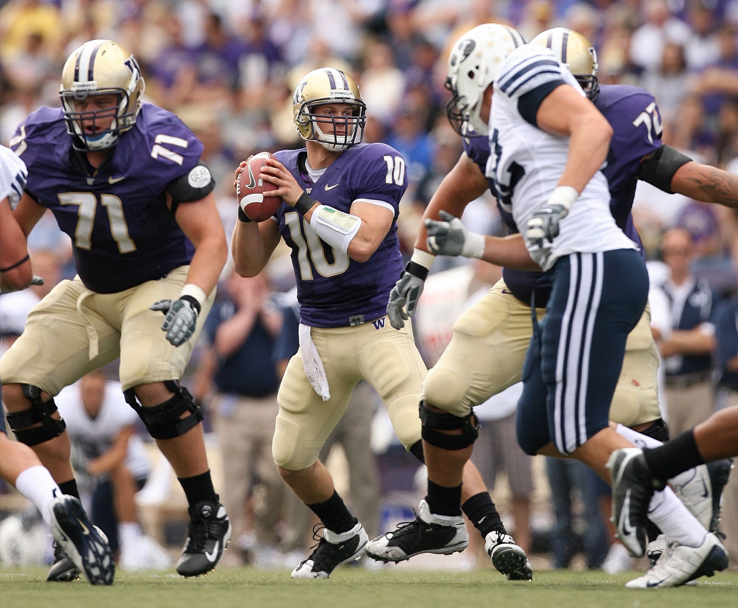 SEATTLE - SEPTEMBER 6:  Jake Locker #10 of the Washington Huskies looks to make a pass play during their game against the BYU Cougars on September 6, 2008 at Husky Stadium in Seattle, Washington. The Cougars defeated the Huskies 28-27. (Photo by Otto Greu