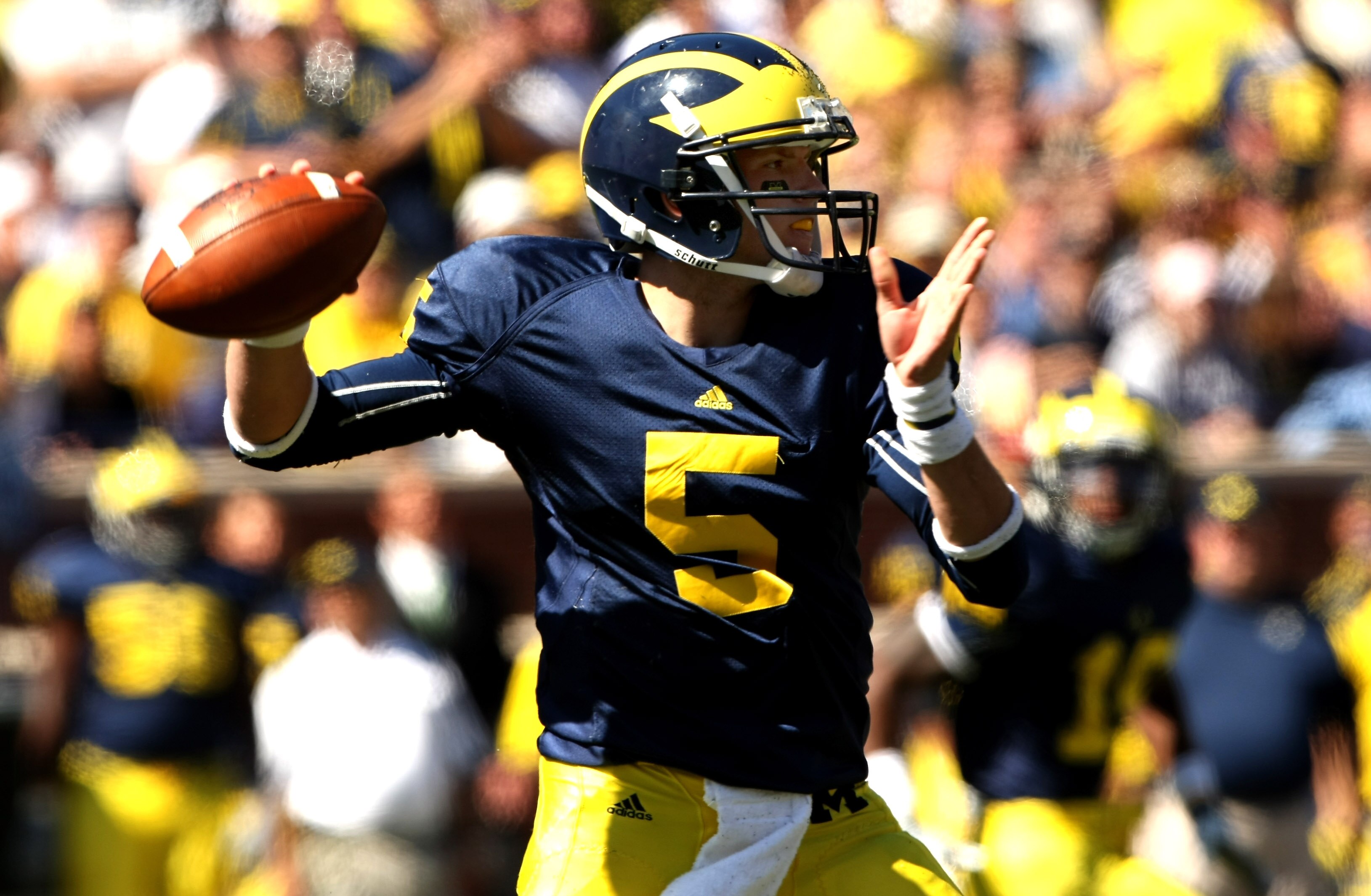 ANN ARBOR, MI - SEPTEMBER 19:  Quarterback Tate Forcier #5 of the Michigan Wolverines throws a pass against the Eastern Michigan Eagles at Michigan Stadium on September 19, 2009 in Ann Arbor, Michigan.   Michigan won 45-17.  (Photo by Stephen Dunn/Getty I