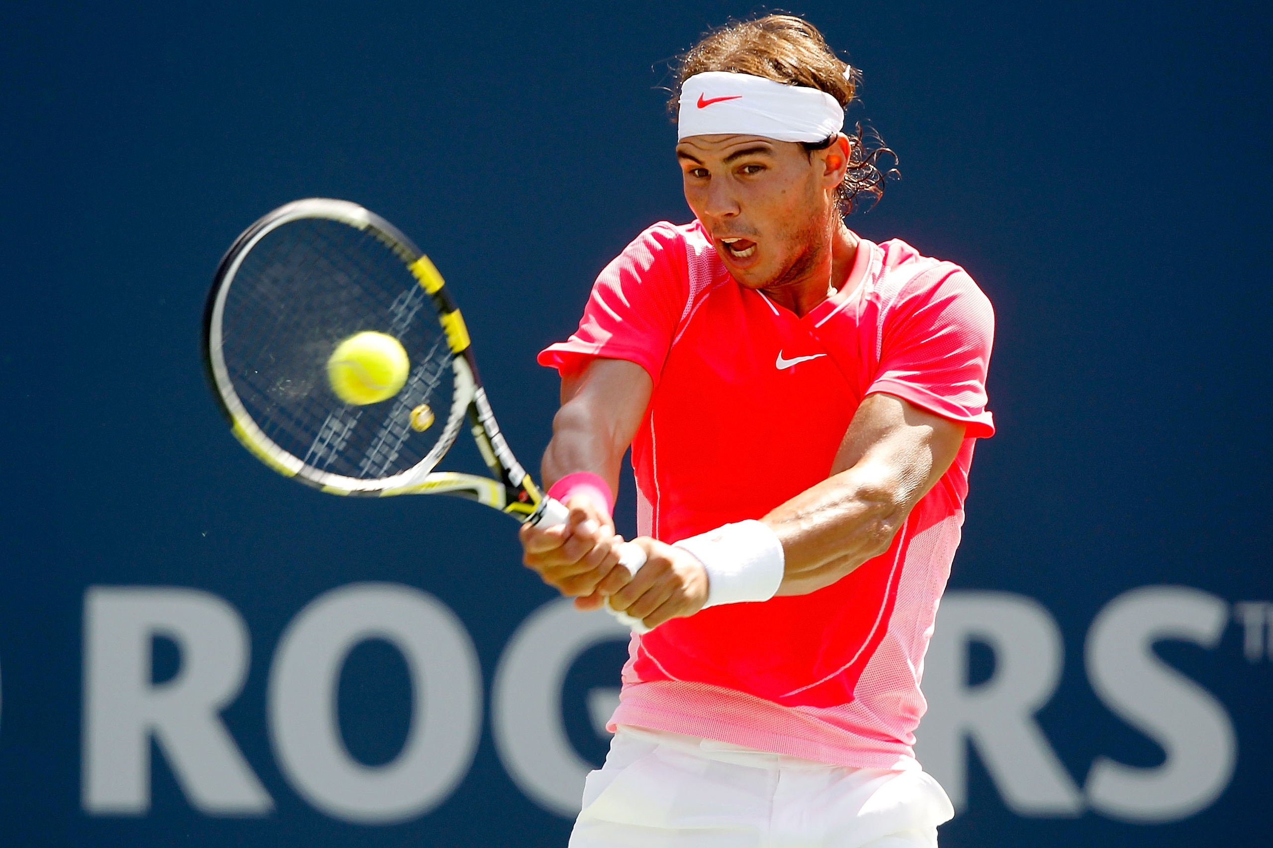 TORONTO, ON - AUGUST 13: Rafael Nadal of Spain returns a shot to Philipp Kohlschreiber of Fermany during the quarterfinals of the Rogers Cup at the Rexall Centre on August 13, 2010 in Toronto, Canada.  (Photo by Matthew Stockman/Getty Images)