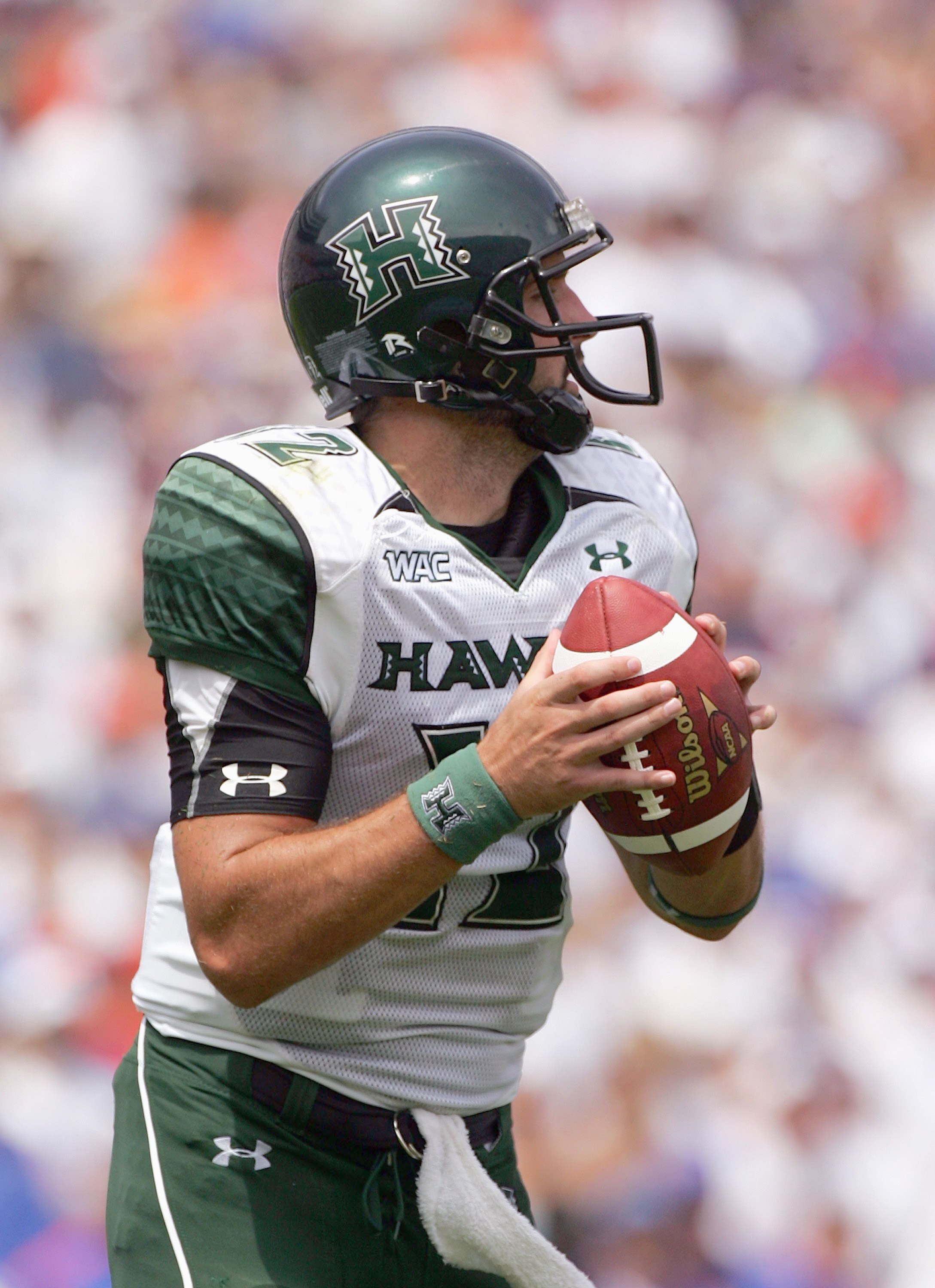 GAINESVILLE, FL - AUGUST 30:  Quarterback Greg Alexander #12 of the Hawaii Warriors looks to pass during the game against the FLorida Gators at Ben Hill Griffin Stadium on August 30, 2008 in Gainesville, Florida.  (Photo by Sam Greenwood/Getty Images)