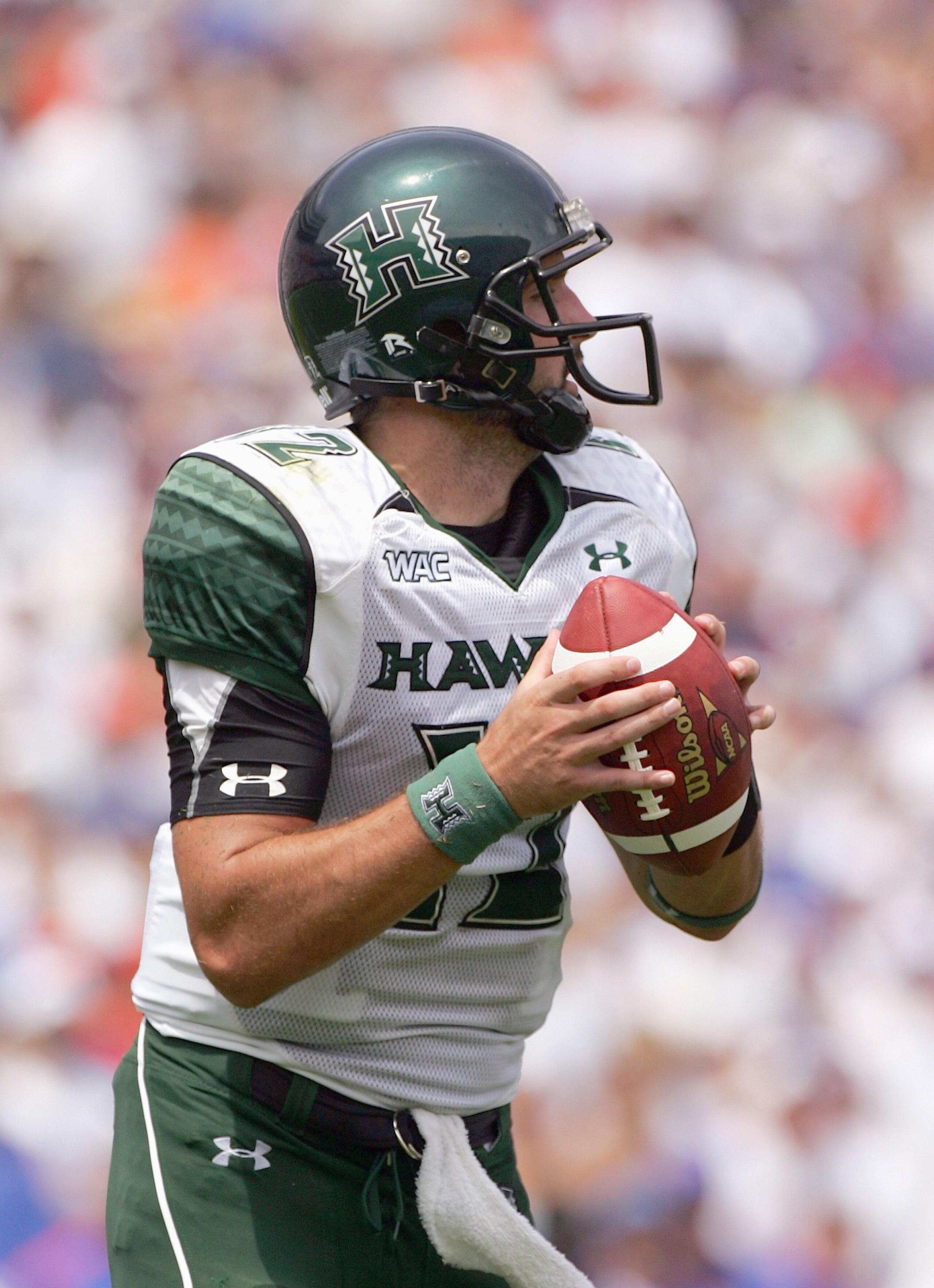 GAINESVILLE, FL - AUGUST 30:  Quarterback Greg Alexander #12 of the Hawaii Warriors looks to pass during the game against the FLorida Gators at Ben Hill Griffin Stadium on August 30, 2008 in Gainesville, Florida.  (Photo by Sam Greenwood/Getty Images)