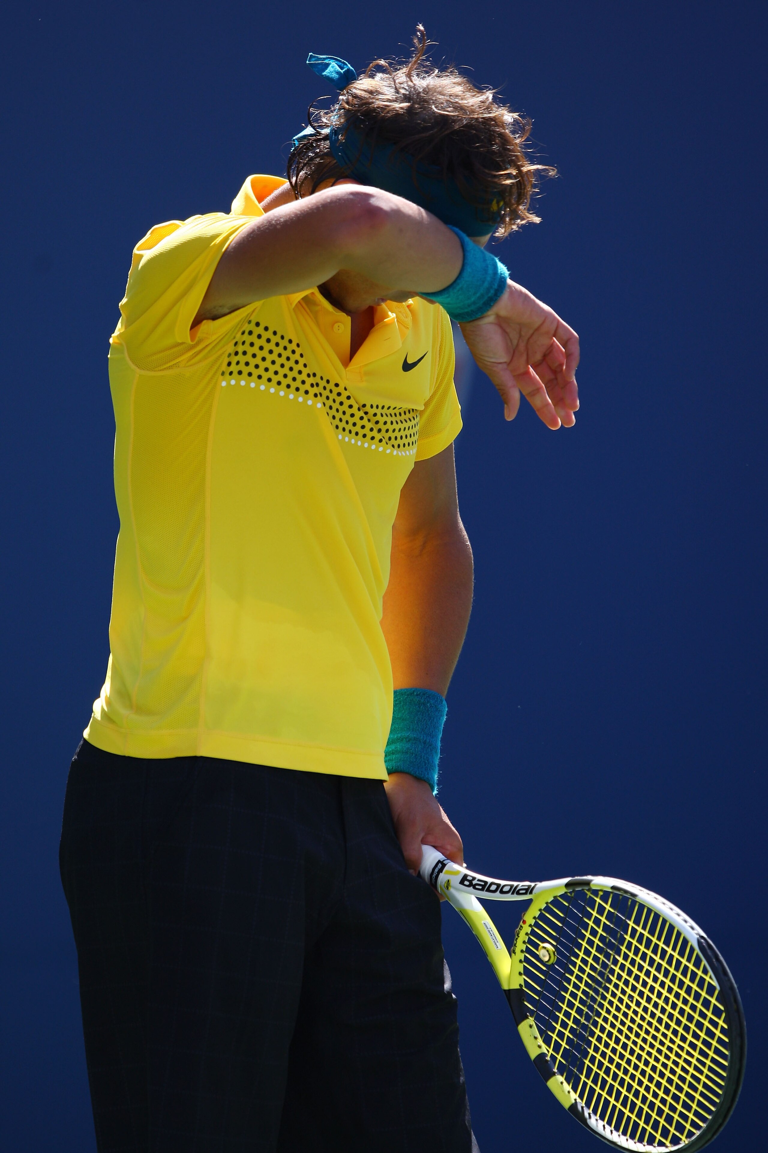 NEW YORK - SEPTEMBER 13:  Rafael Nadal of Spain wipes his brow during the Menï¿½s Singles Semifinal match against Juan Martin Del Potro of Argentina on day fourteen of the 2009 U.S. Open at the USTA Billie Jean King National Tennis Center on September 13, 2