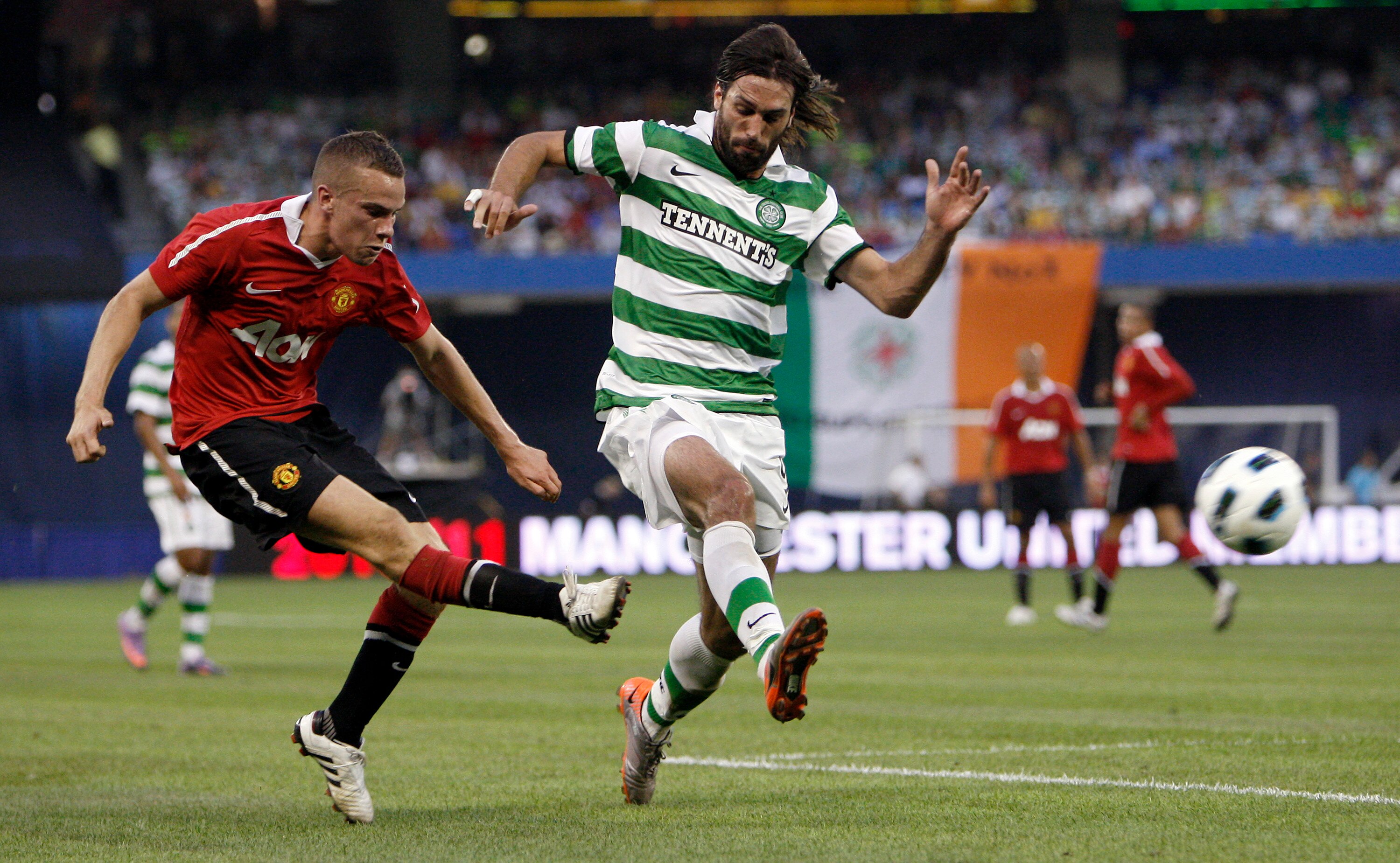 TORONTO - JULY 16: Tom Cleverly #35 of Manchester United kicks the ball from Georgios Samaras #9 of Celtic F.C. during a friendly match at the Rogers Centre July 16, 2010 in Toronto, Ontario, Canada. (Photo by Abelimages/Getty Images)