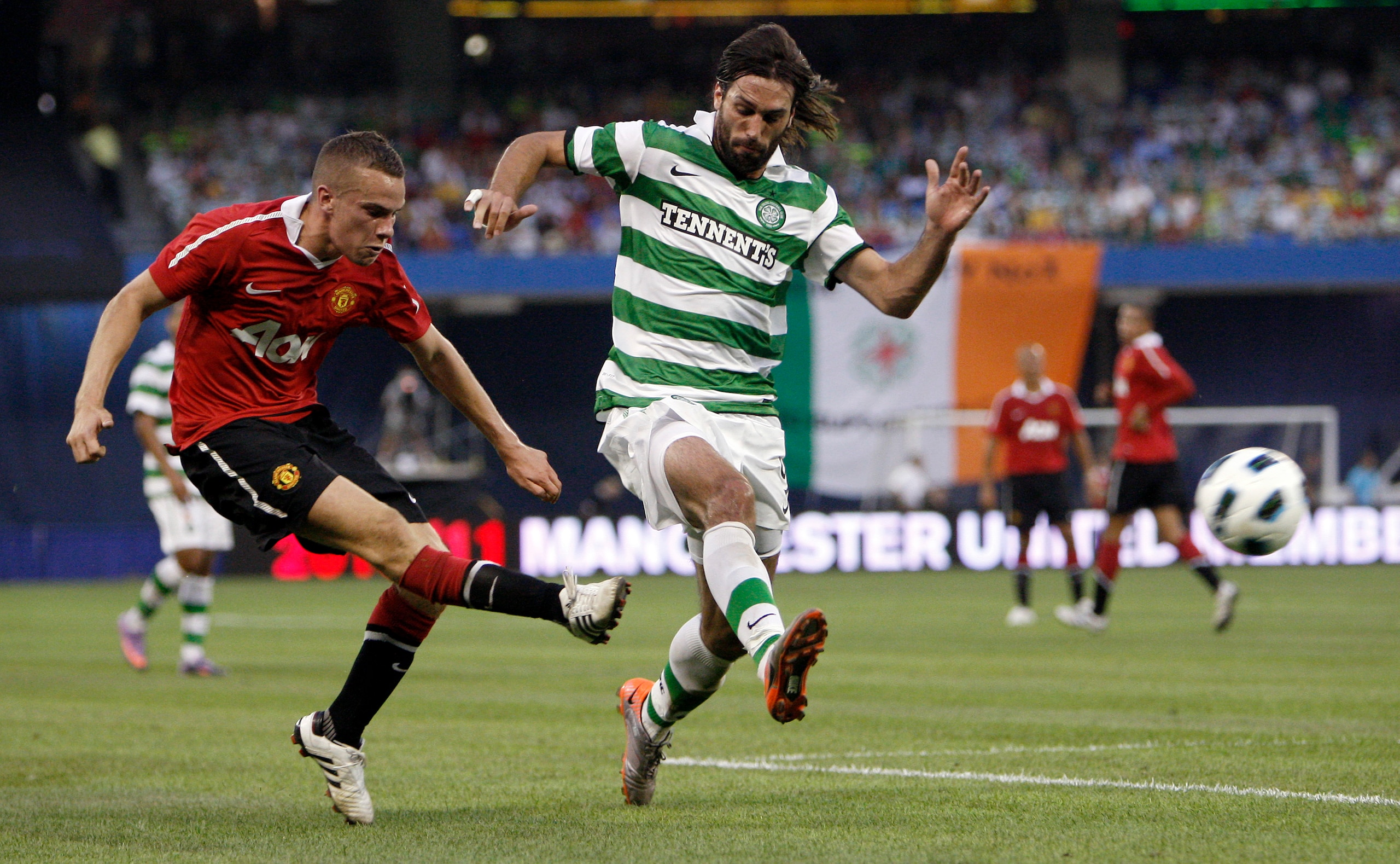 TORONTO - JULY 16: Tom Cleverly #35 of Manchester United kicks the ball from Georgios Samaras #9 of Celtic F.C. during a friendly match at the Rogers Centre July 16, 2010 in Toronto, Ontario, Canada. (Photo by Abelimages/Getty Images)