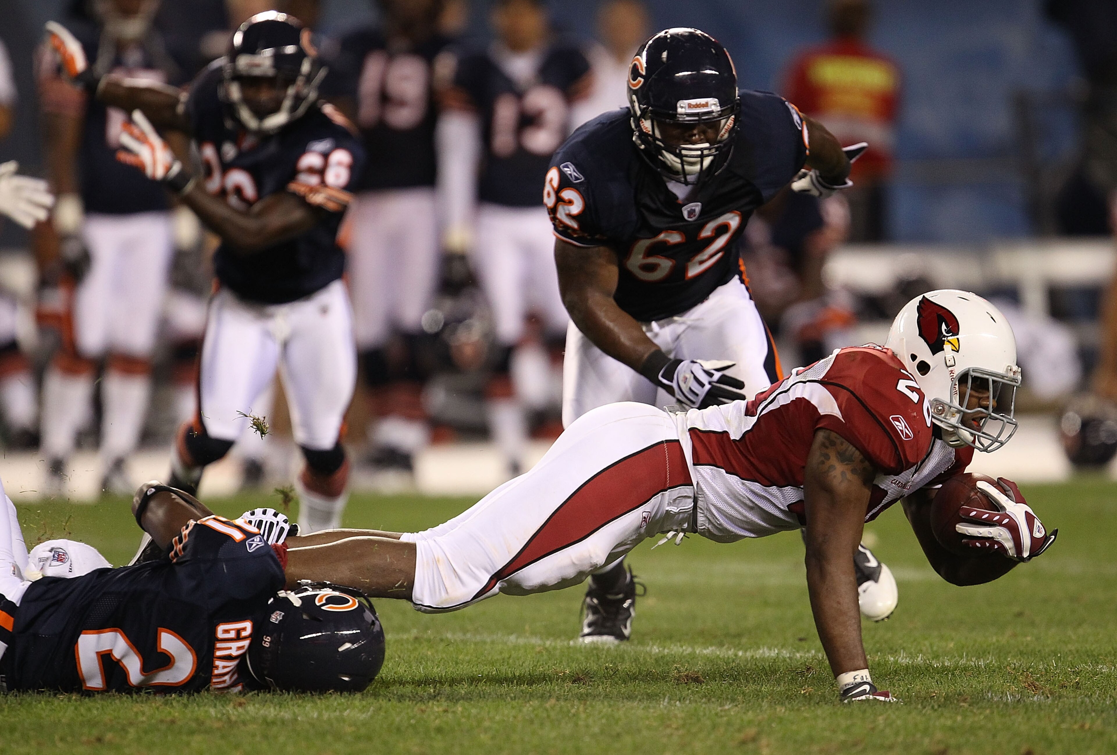 CHICAGO - AUGUST 28: Corey Graham #21 of the Chicago Bears drops Beanie Wells #26 of the Arizona Cardinals during a preseason game at Soldier Field on August 28, 2010 in Chicago, Illinois. The Cardinals defeated the Bears 14-9. (Photo by Jonathan Daniel/G CHICAGO - AUGUST 28: Corey Graham #21 of the Chicago Bears drops Beanie Wells #26 of the Arizona Cardinals during a preseason game at Soldier Field on August 28, 2010 in Chicago, Illinois. The Cardinals defeated the Bears 14-9. (Photo by Jonathan Daniel/G