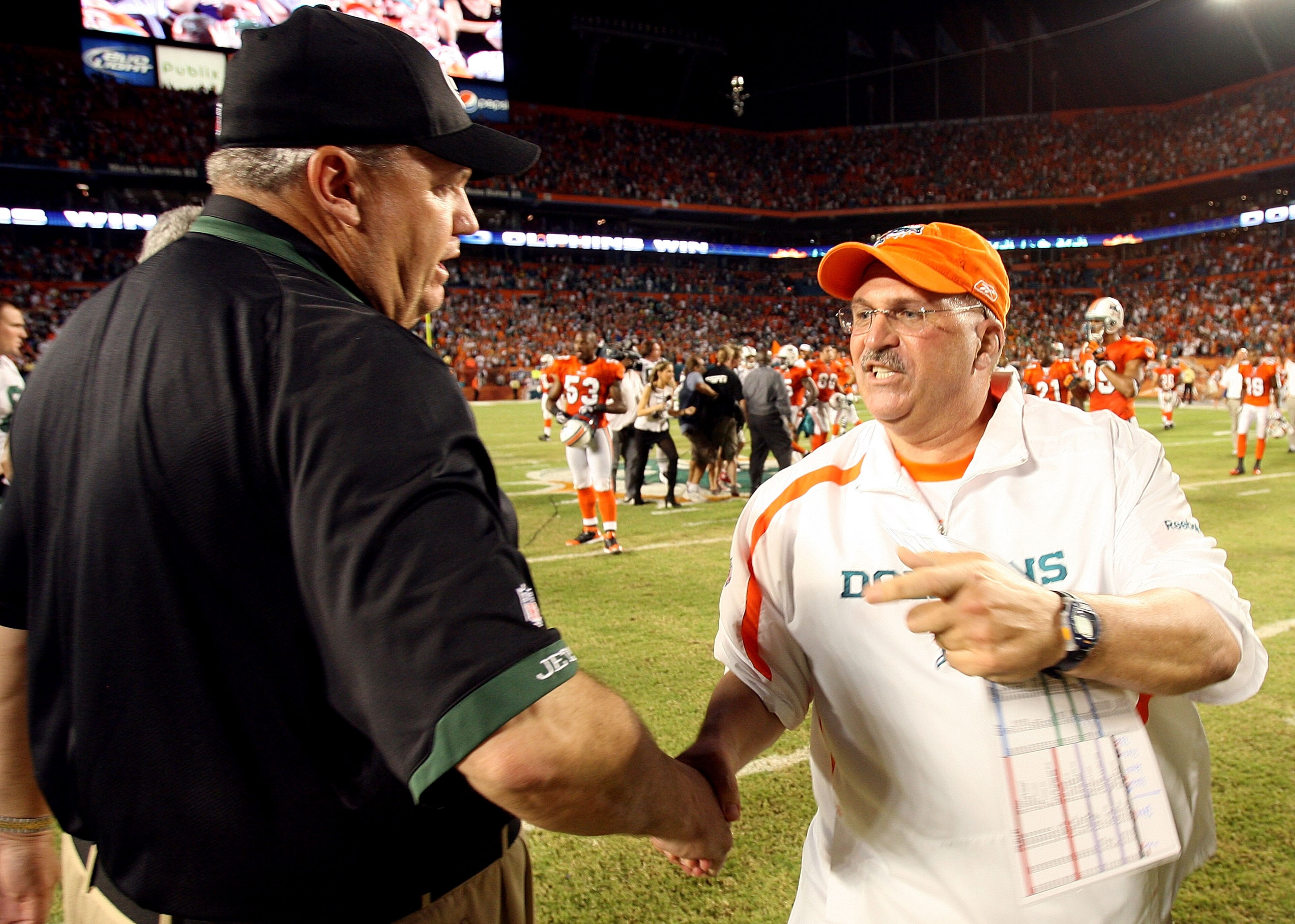 MIAMI - OCTOBER 12: Head coach Rex Ryan of the New York Jets congratulates head coach Tony Sparano of the Miami Dolphins at Land Shark Stadium on October 12, 2009 in Miami, Florida. The Dolphins defeated the Jets 31-27. (Photo by Doug Benc/Getty Images) MIAMI - OCTOBER 12: Head coach Rex Ryan of the New York Jets congratulates head coach Tony Sparano of the Miami Dolphins at Land Shark Stadium on October 12, 2009 in Miami, Florida. The Dolphins defeated the Jets 31-27. (Photo by Doug Benc/Getty Images)