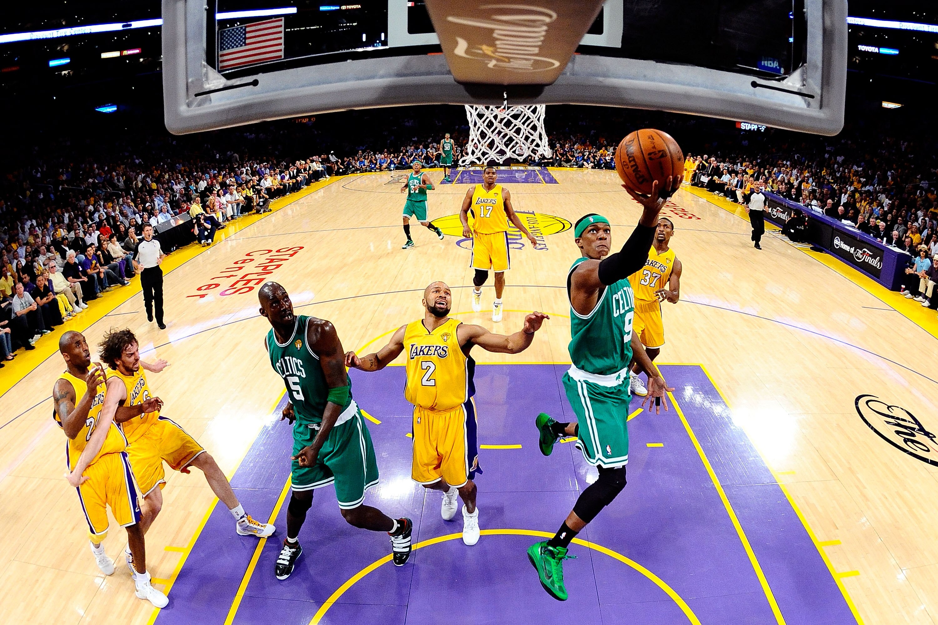 LOS ANGELES, CA - JUNE 17:  Rajon Rondo #9 of the Boston Celtics lays the ball up over Derek Fisher #2 of the Los Angeles Lakers in Game Seven of the 2010 NBA Finals at Staples Center on June 17, 2010 in Los Angeles, California.  NOTE TO USER: User expres