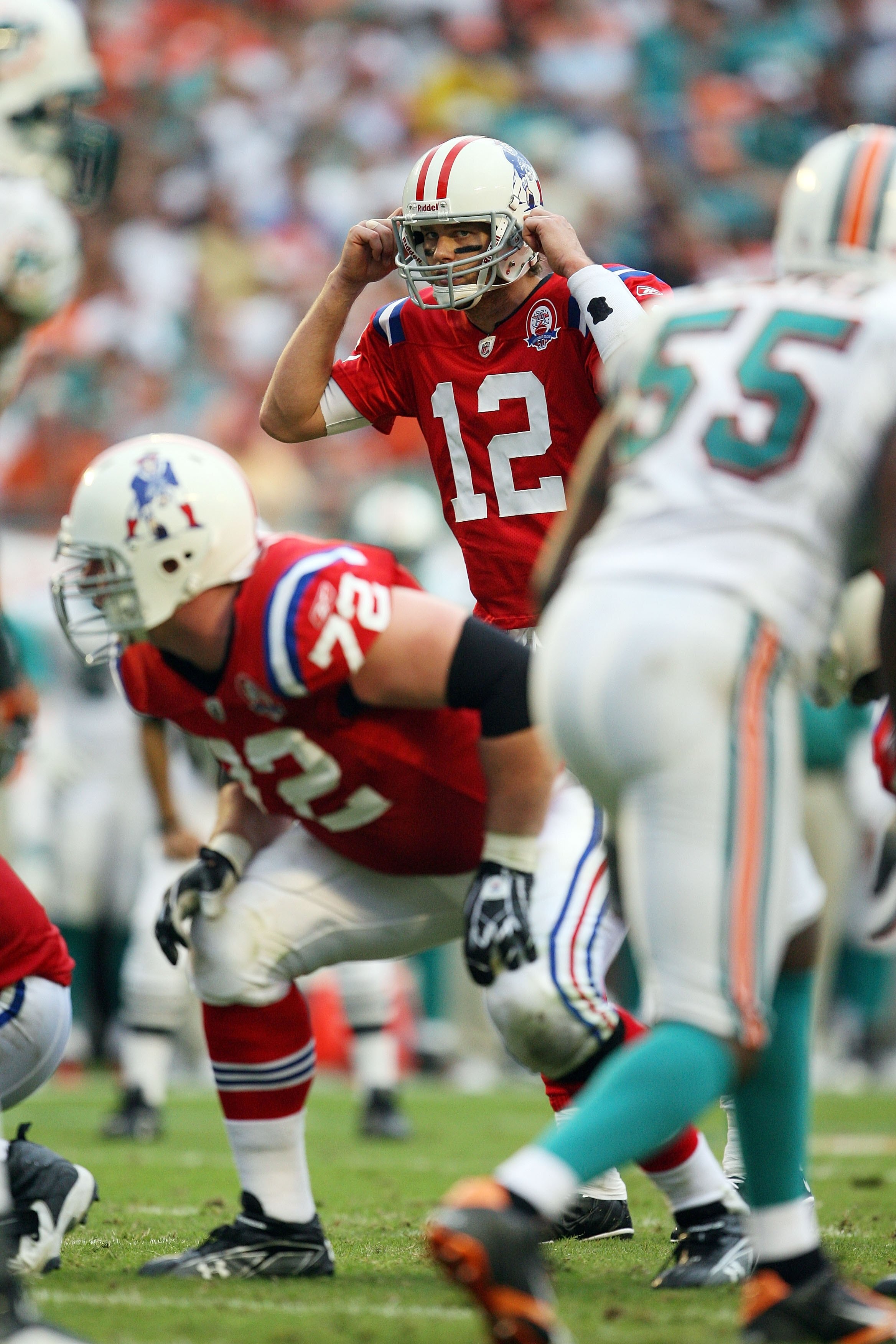 MIAMI - DECEMBER 06:  Quarterback Tom Brady #12 of the New England Patriots calls out a play from the line of scrimmage against the Miami Dolphins at Land Shark Stadium on December 6, 2009 in Miami, Florida. The Dolphins defeated the Patriots 22-21.  (Pho
