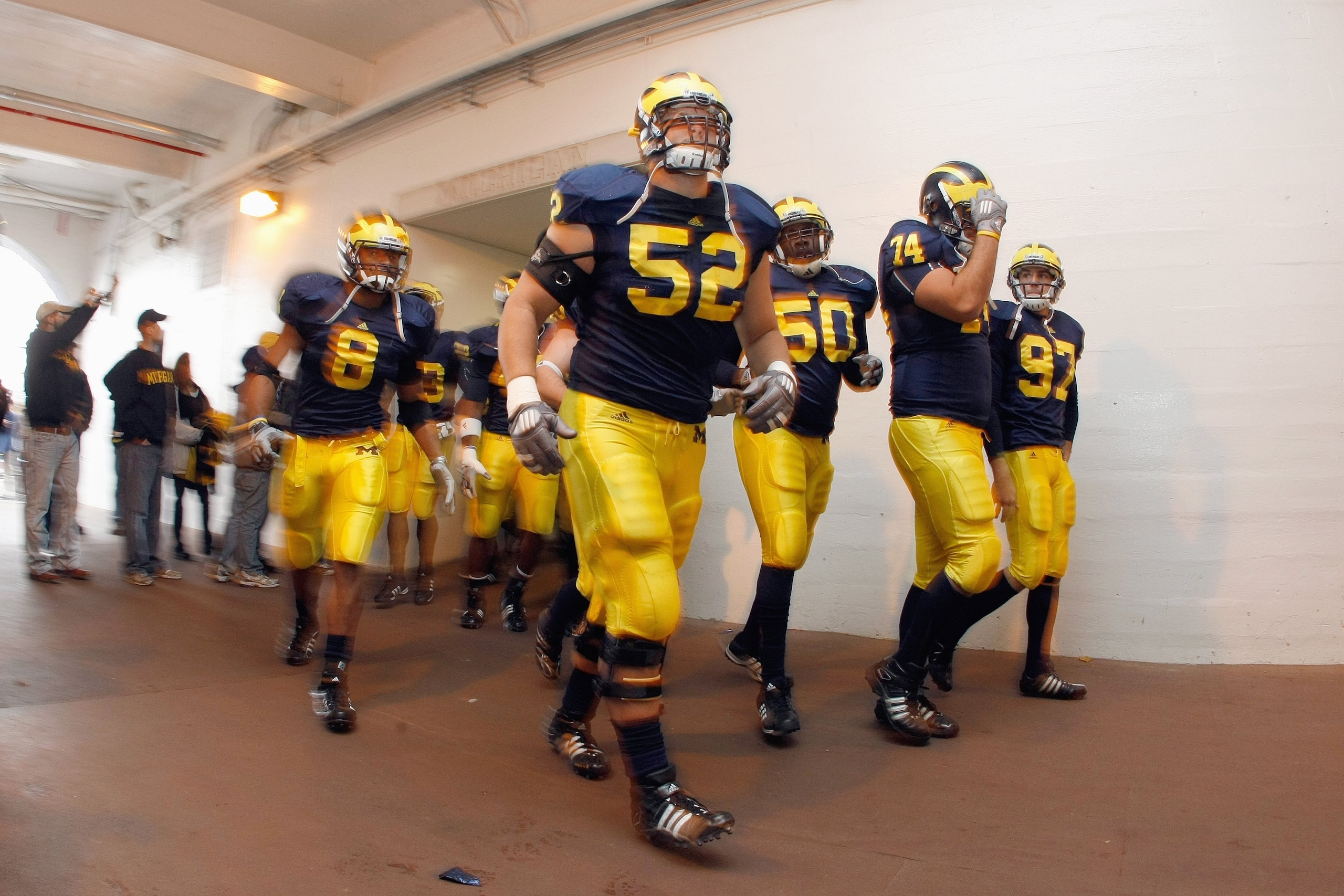 ANN ARBOR, MI - NOVEMBER 21: Kevin Leach #52 of the Michigan Wolverines jogs through the tunnel before the game against the Ohio State Buckeyes on November 21, 2009 at Michigan Stadium in Ann Arbor, Michigan. Ohio State won the game 21-10. (Photo by Grego