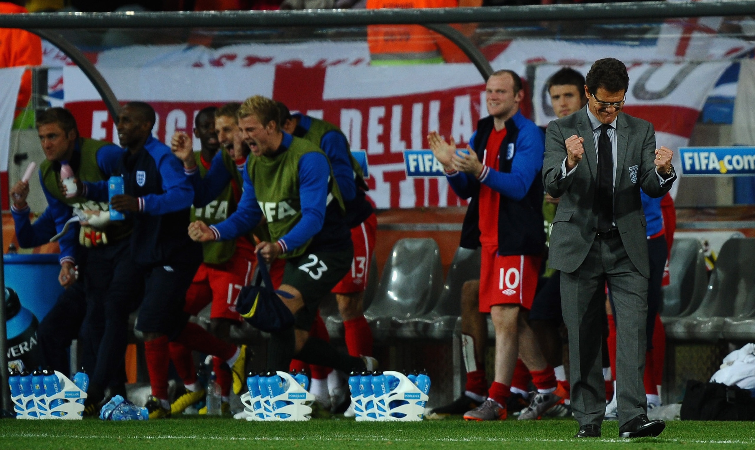 PORT ELIZABETH, SOUTH AFRICA - JUNE 23:  Fabio Capello manager of England celebrates victory in front of his subs bench during the 2010 FIFA World Cup South Africa Group C match between Slovenia and England at the Nelson Mandela Bay Stadium on June 23, 20