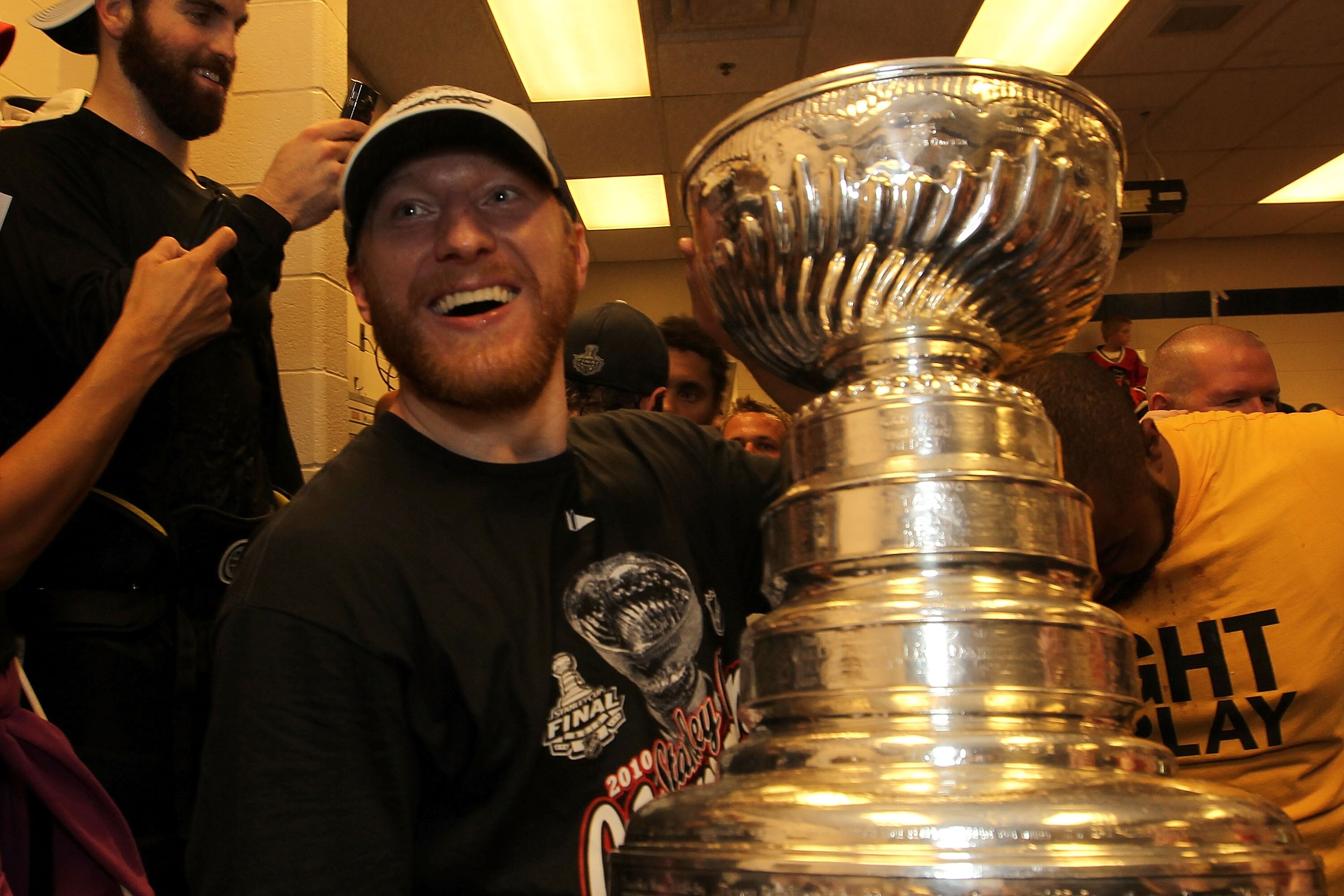PHILADELPHIA - JUNE 09:  Marian Hossa #81 of the Chicago Blackhawks hoists the Stanley Cup in the locker room after the Blackhawks defeat the Philadelphia Flyers 4-3 and win the Stanley Cup in Game Six of the 2010 NHL Stanley Cup Final at the Wachovia Cen