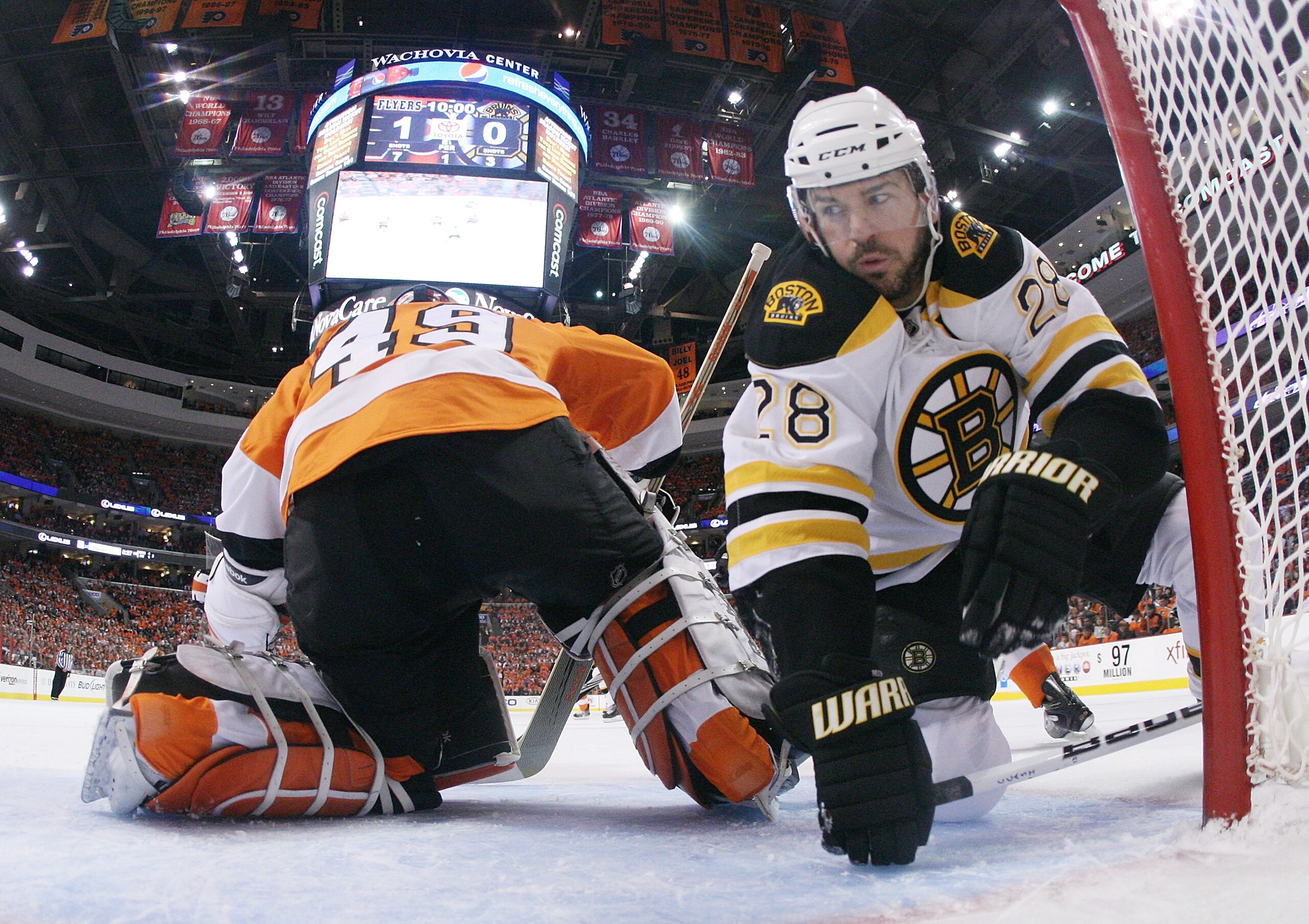 PHILADELPHIA - MAY 12: Mark Recchi #28 of the Boston Bruins trips in the crease behind Michael Leighton #49 of the Philadelphia Flyers in Game Six of the Eastern Conference Semifinals during the 2010 NHL Stanley Cup Finals at the Wachovia Center on May 12