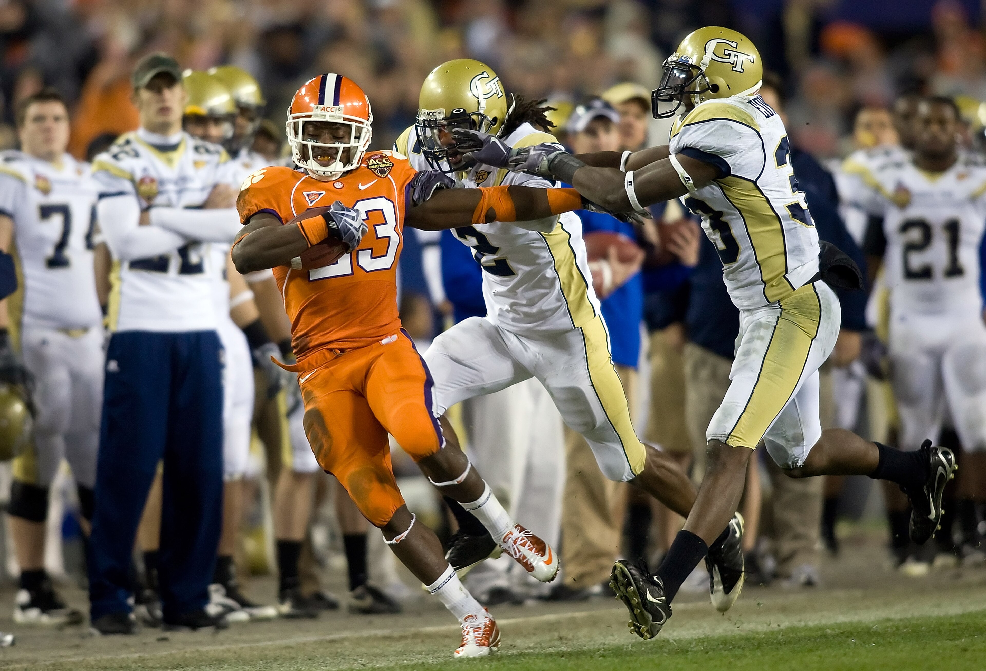 TAMPA, FL - DECEMBER 05:  Running back Andre Ellington #23 of the Clemson Tigers is knocked out of bounds by defenders Mario Butler #2 and Mario Edwards #33 of the Georgia Tech Yellow Jackets in the 2009 ACC Football Championship game at Raymond James Sta