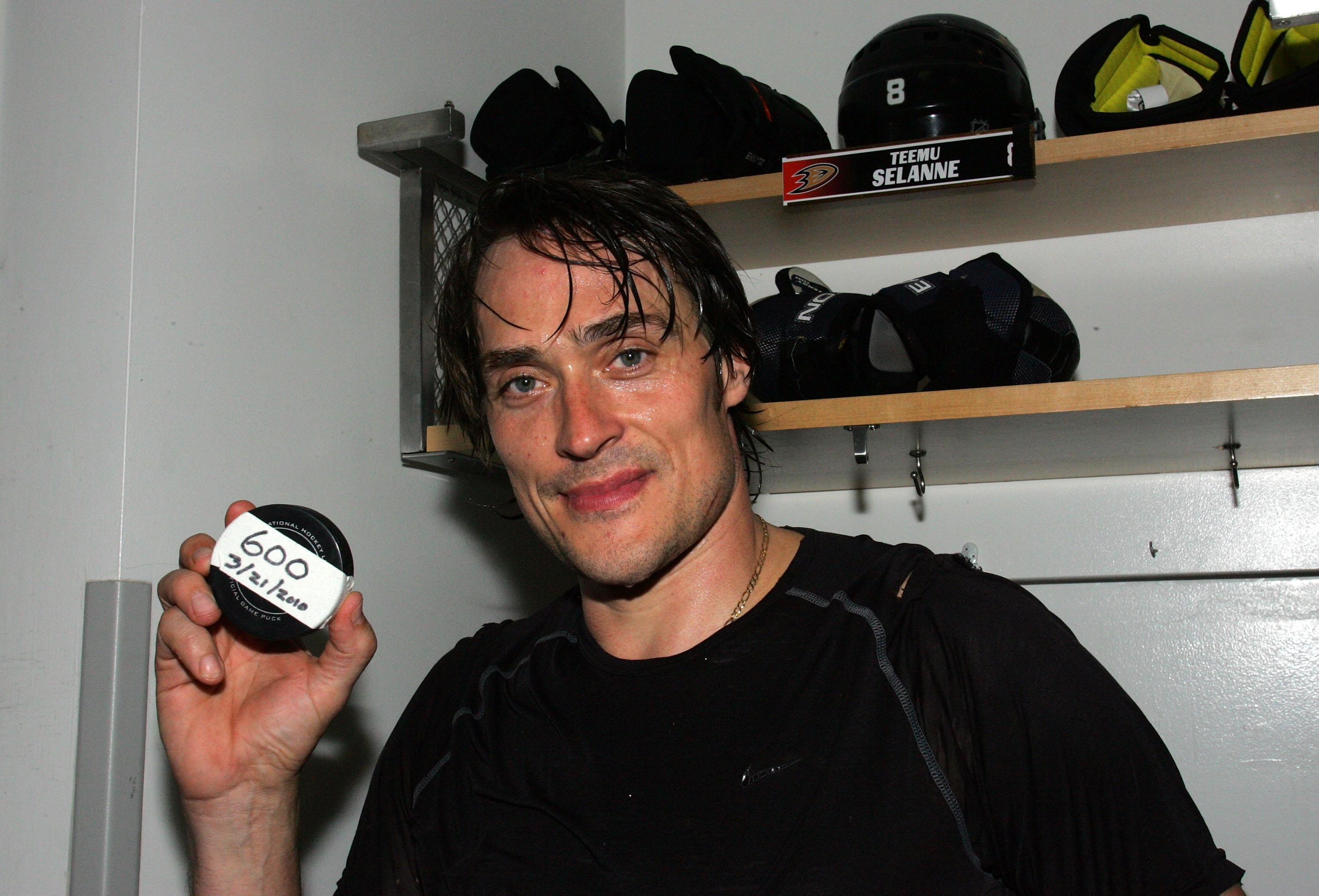 ANAHEIM, CA - MARCH 21:  Teemu Selanne #8 of the Anaheim Ducks holds up the puck with which he scored his 600th career NHL goal against the Colorado Avalanche after their NHL game at the Honda Center on March 21, 2010 in Anaheim, California. The Ducks def