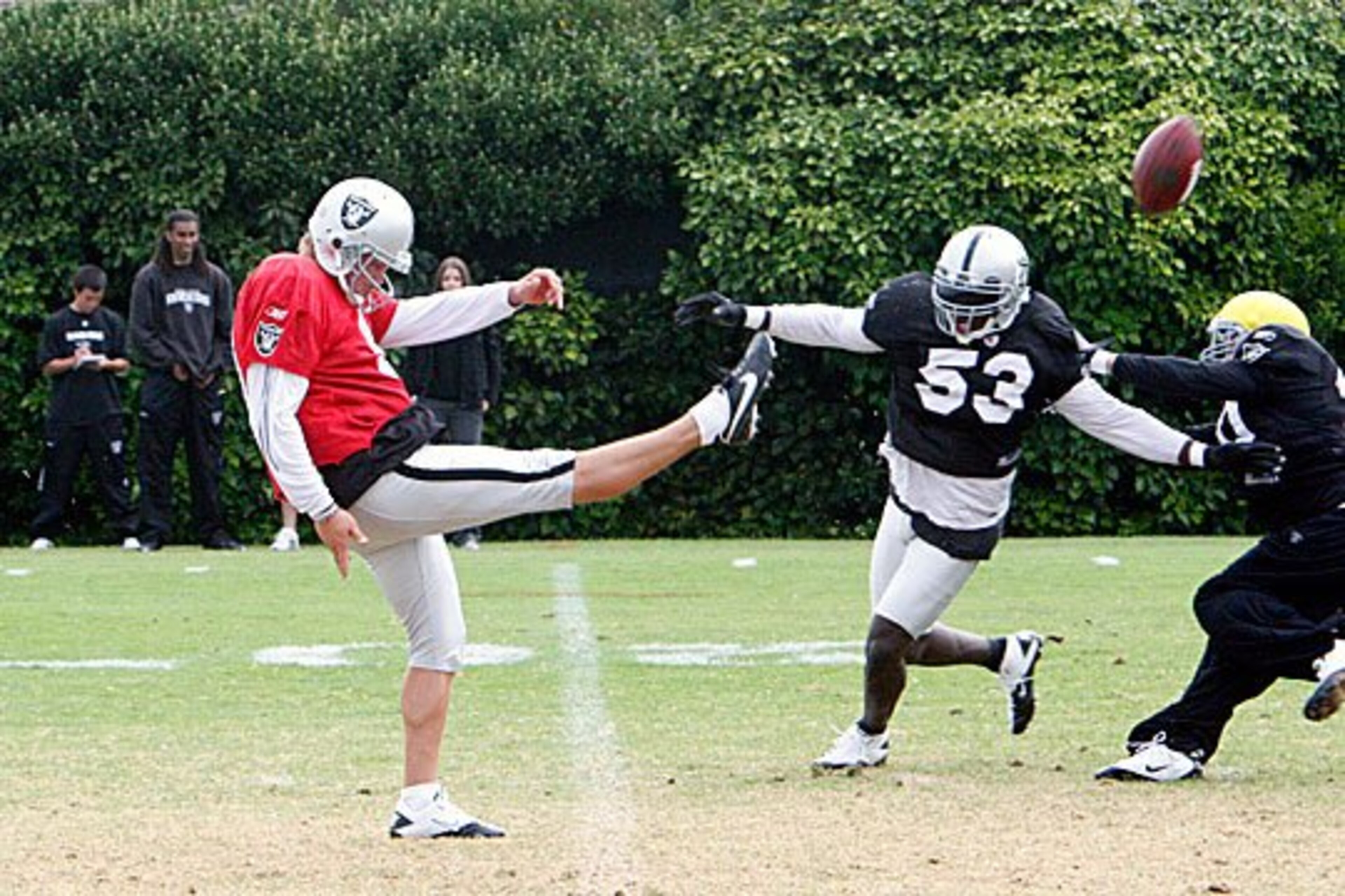 Lechler gets the kick off before Howard can make the play.