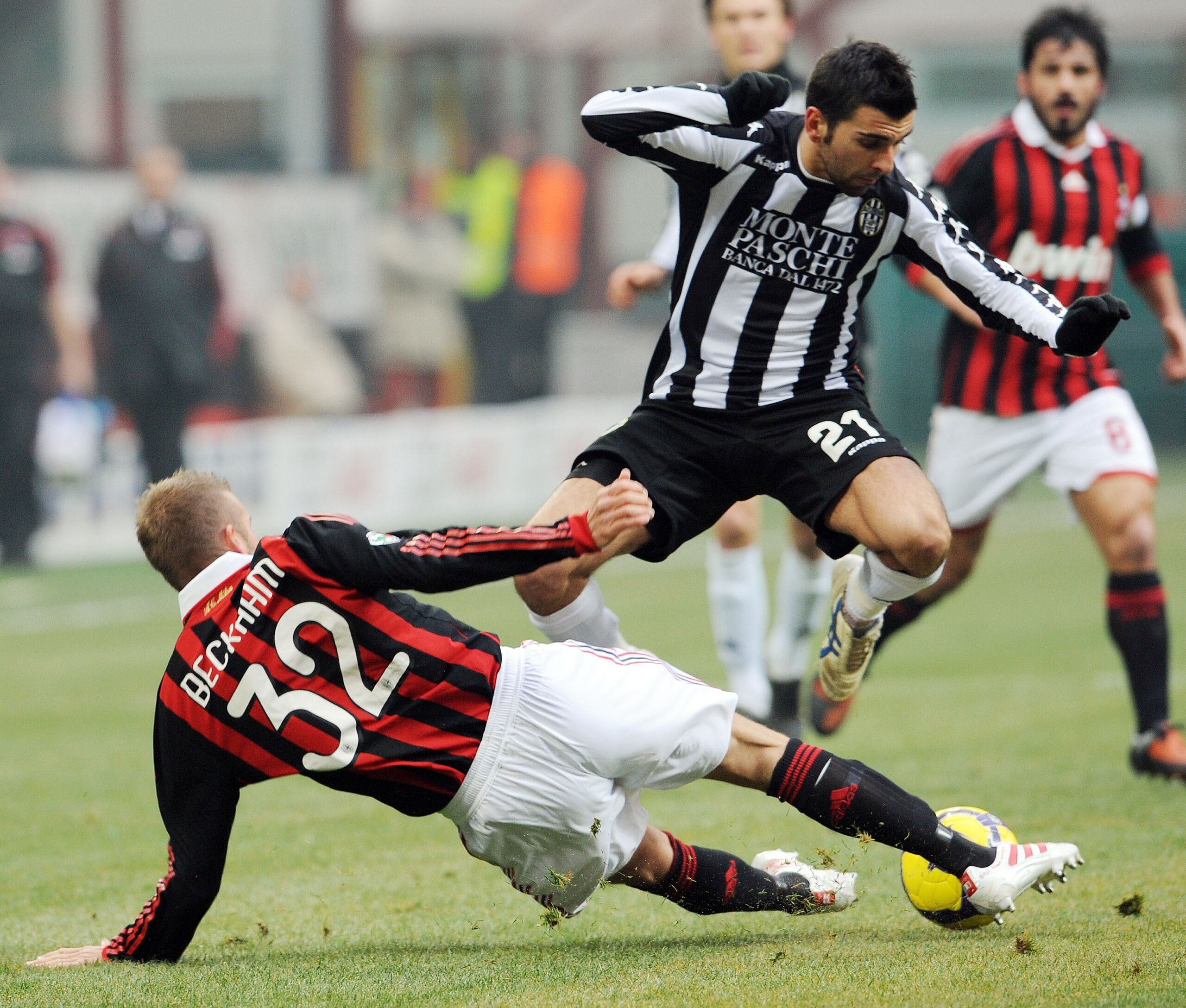 MILAN, ITALY - JANUARY 17:  David Beckham of Milan and Andrea Rossi of Siena in action during the Serie A match between Milan and Siena at Stadio Giuseppe Meazza on January 17, 2010 in Milan, Italy.  (Photo by Giuseppe Bellini/Getty Images)