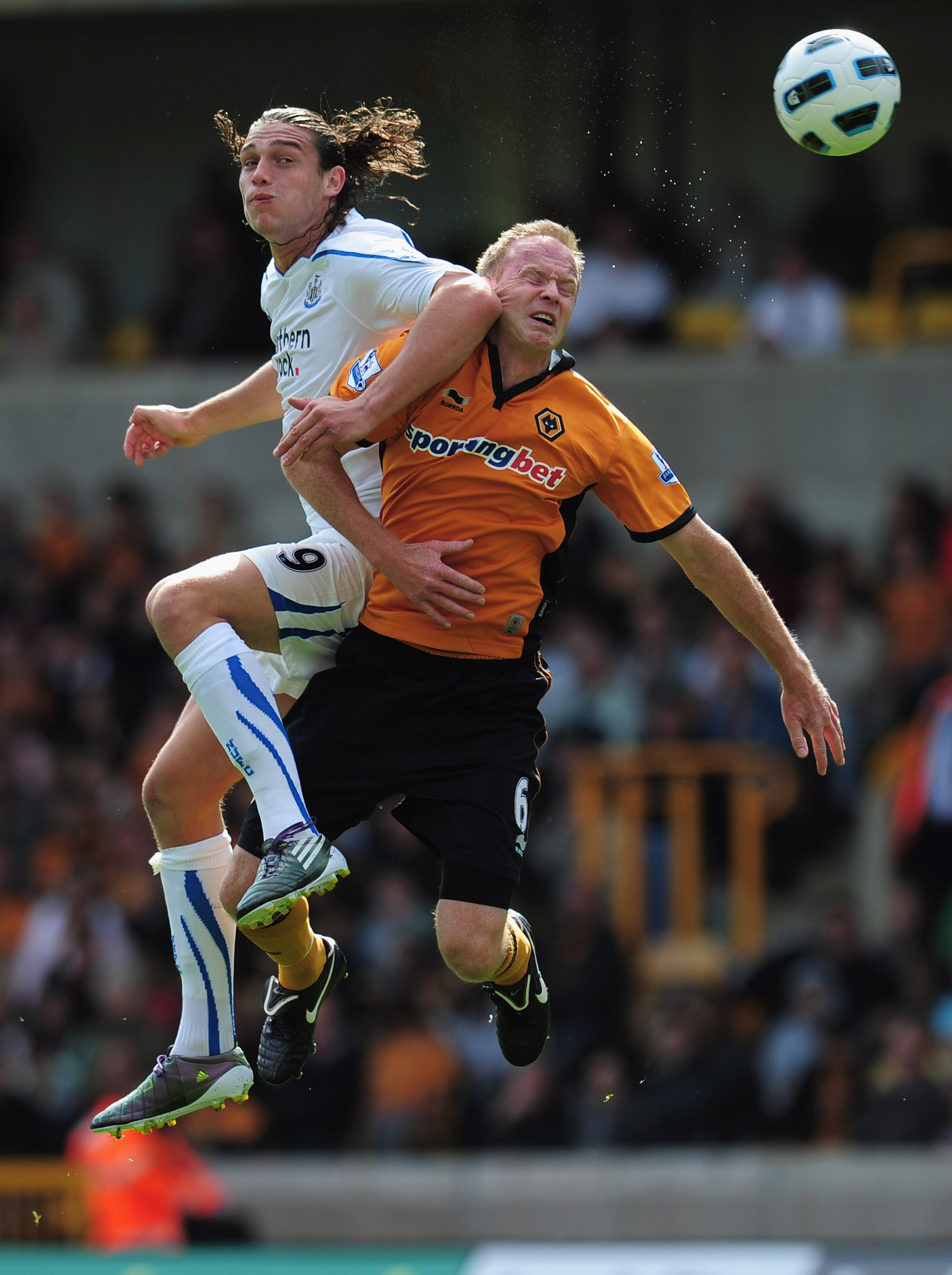 WOLVERHAMPTON, ENGLAND - AUGUST 28:  Andy Carroll of Newcastle United outjumps Jody Craddock of Wolverhampton Wanderers during the Barclays Premier League match between Wolverhampton Wanderers and Newcastle United at Molineux on August 28, 2010 in Wolverh
