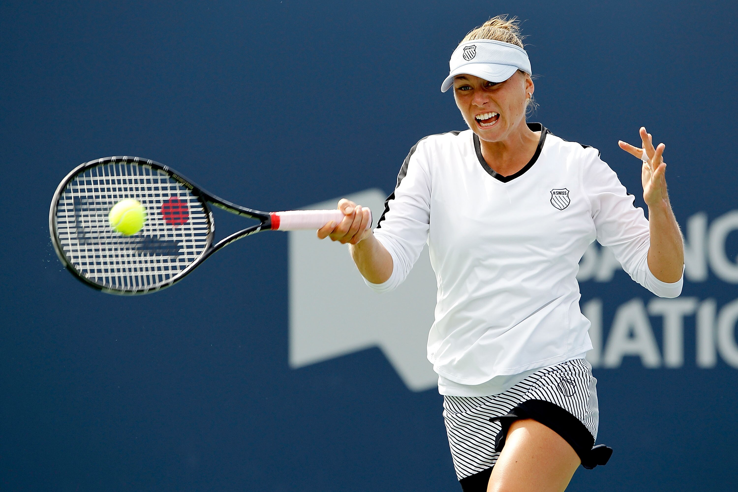 MONTREAL, QC - AUGUST 23: Vera Zvonareva of Russia returns a shot to Victoria Azarenka of Belarus during the semifinals of the Rogers Cup at Stade Uniprix on August 23, 2010 in Montreal, Canada. (Photo by Matthew Stockman/Getty Images) MONTREAL, QC - AUGUST 23: Vera Zvonareva of Russia returns a shot to Victoria Azarenka of Belarus during the semifinals of the Rogers Cup at Stade Uniprix on August 23, 2010 in Montreal, Canada. (Photo by Matthew Stockman/Getty Images)